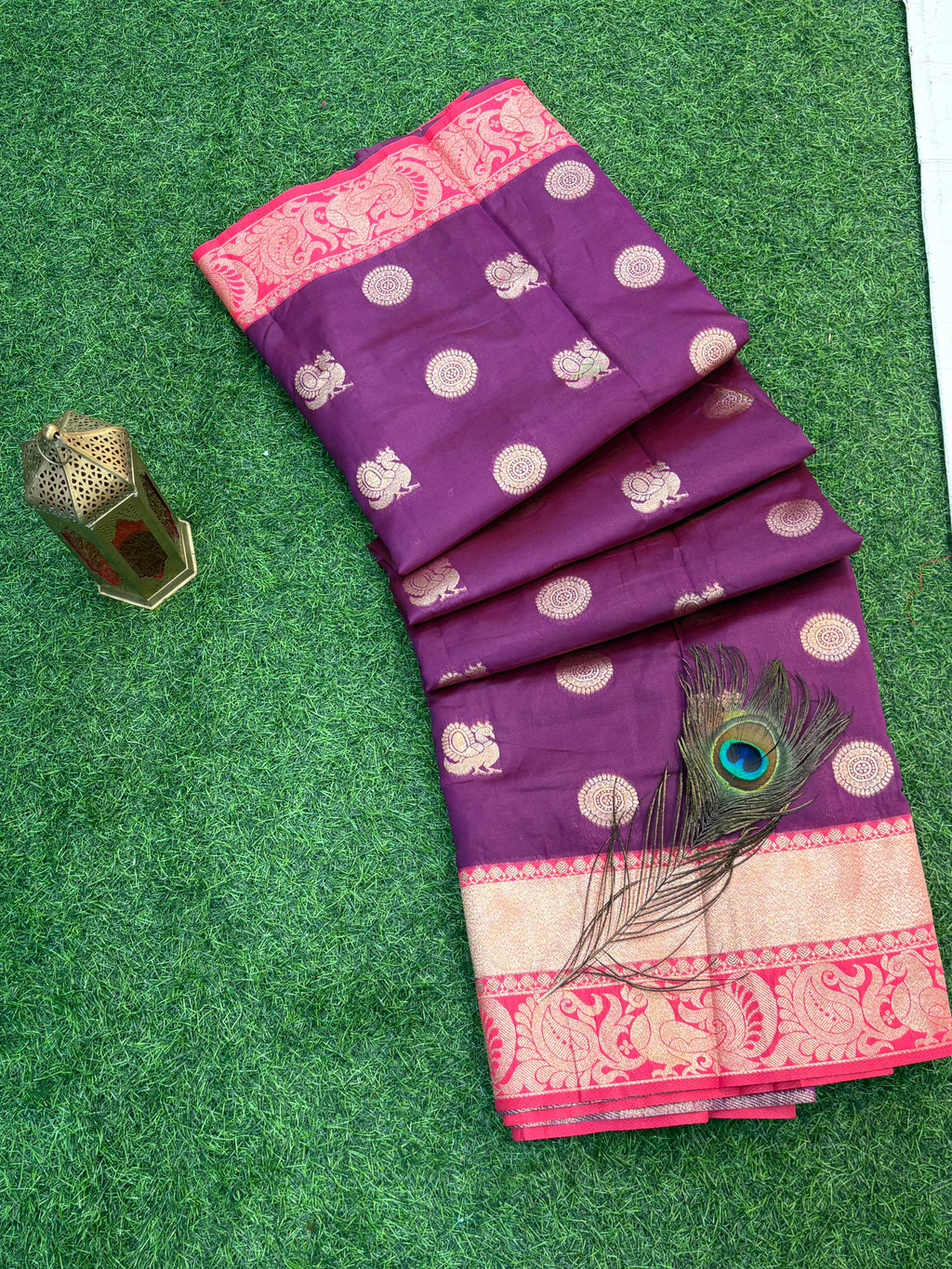 Royal Purple Zari Charm
Luxurious Banarasi silk saree adorned with elegant gold zari butti motifs and a rich contrast zari-woven border, perfect for weddings and festive occasions.