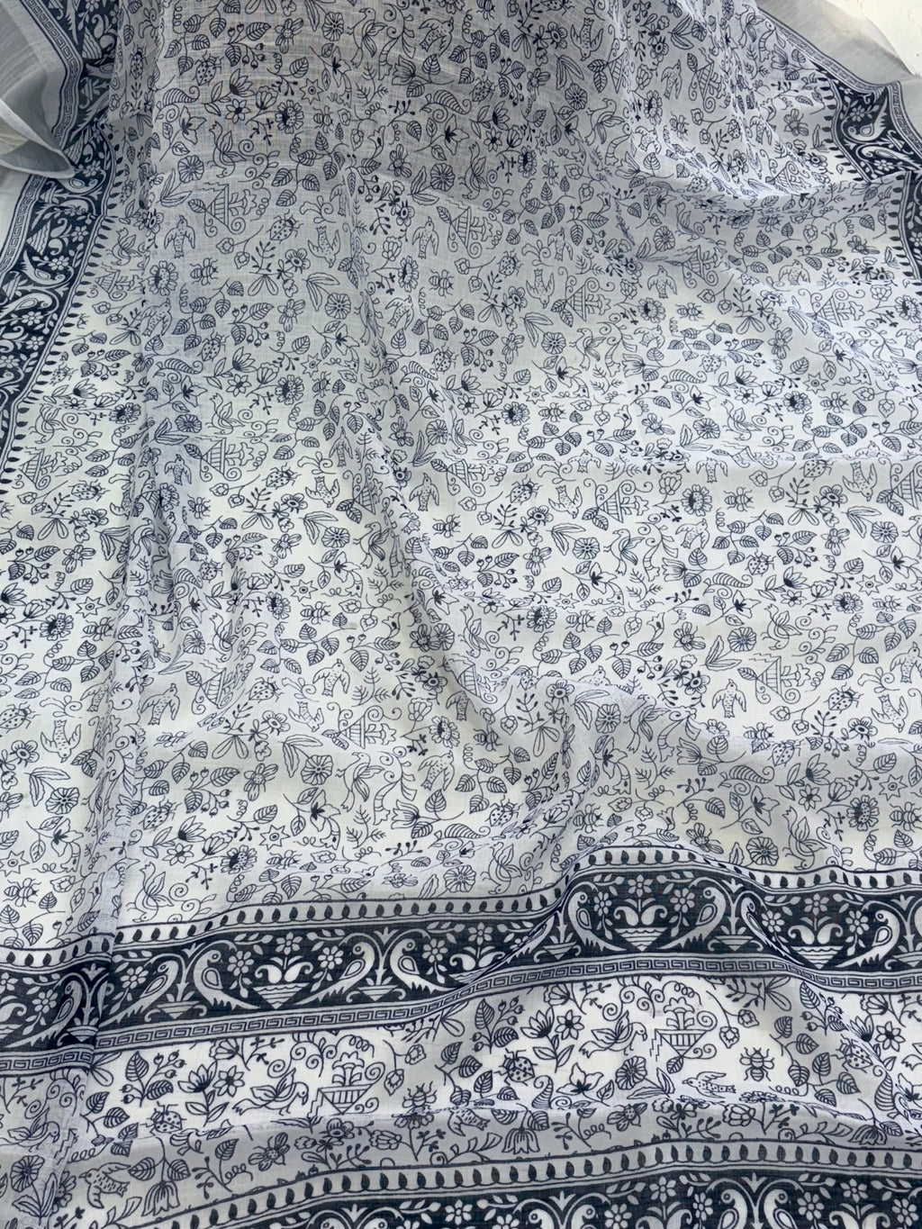 Cotton saree white and blue midnight colour silver colour zari border and peacock & floral motifs silver border often called a checked  Patola design