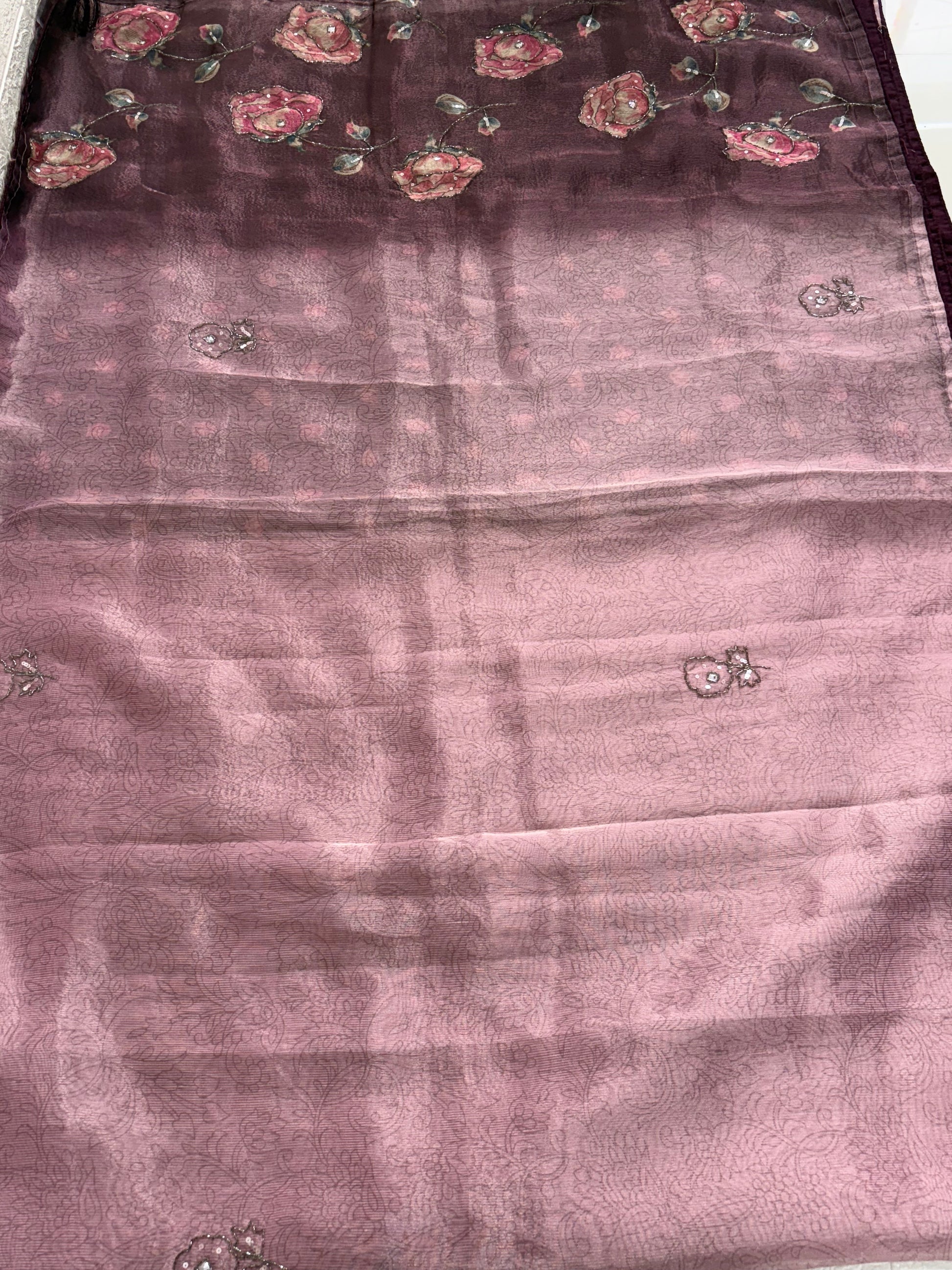 Name: Lavender Floral rust tissue fabric Saree
Lightweight with subtle floral embroidery and pastel printed motifs, offering a soft and elegant sheen.
