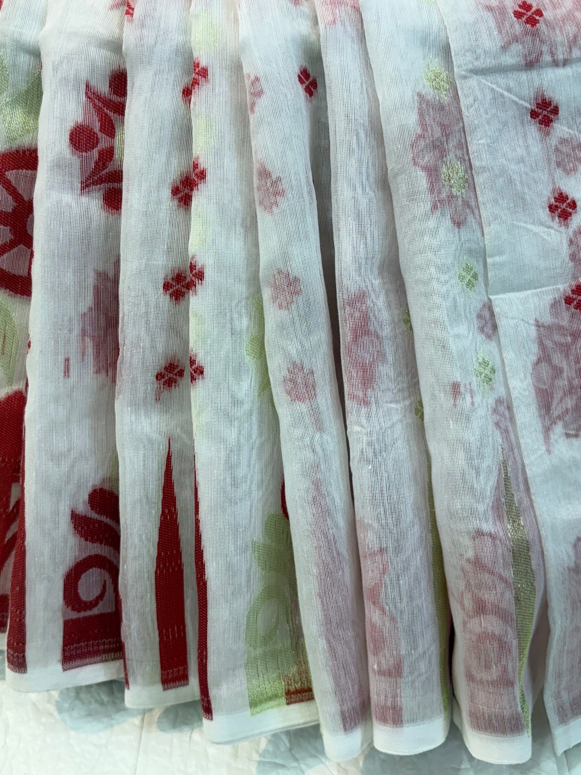 Classic Red Bloom Jamdani Saree cotton Jamdani, showcasing traditional red floral motifs with subtle gold accents on a soft, sheer handwoven base.