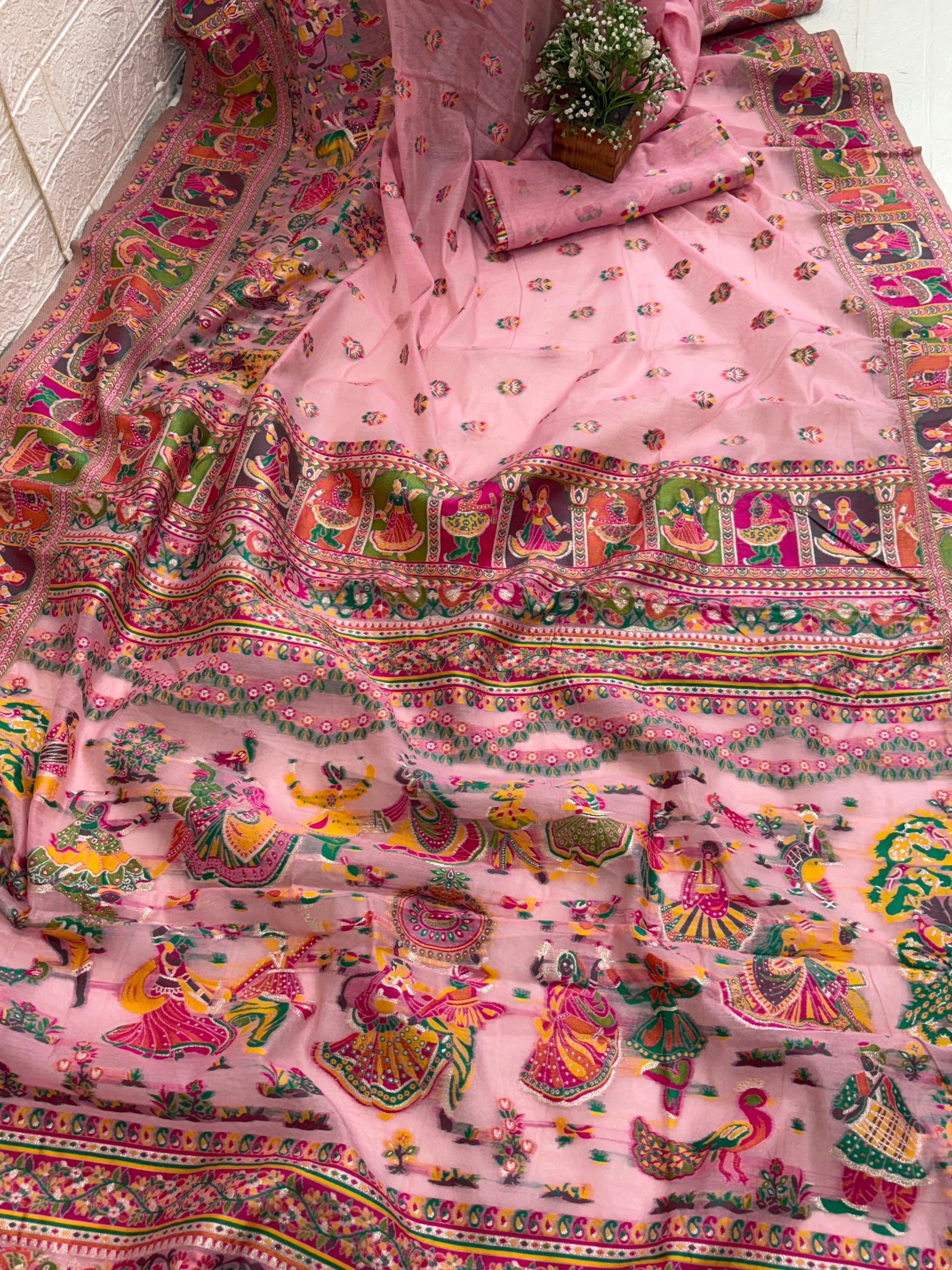 The saree appears to be a Gharchola or a similar style of hand-woven Indian saree, possibly a type of  Chanderi  Silk blend.multicolour in saree and multicolour border best look at festival