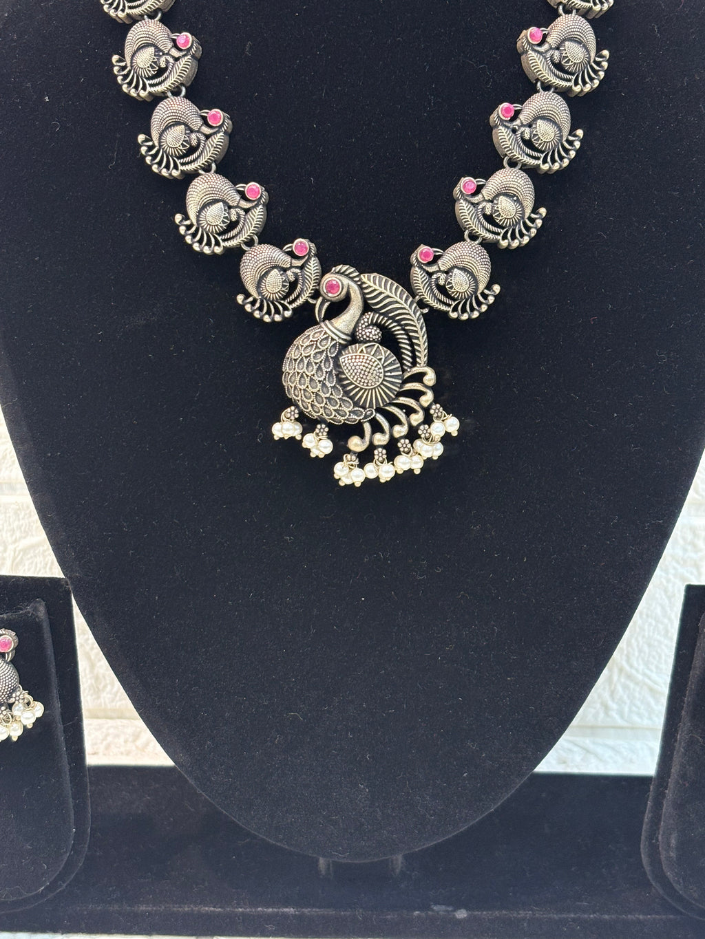 Name: Antique Peacock Oxidized Necklace Set German silver with pink ruby stone accents and pearl bead embellishments