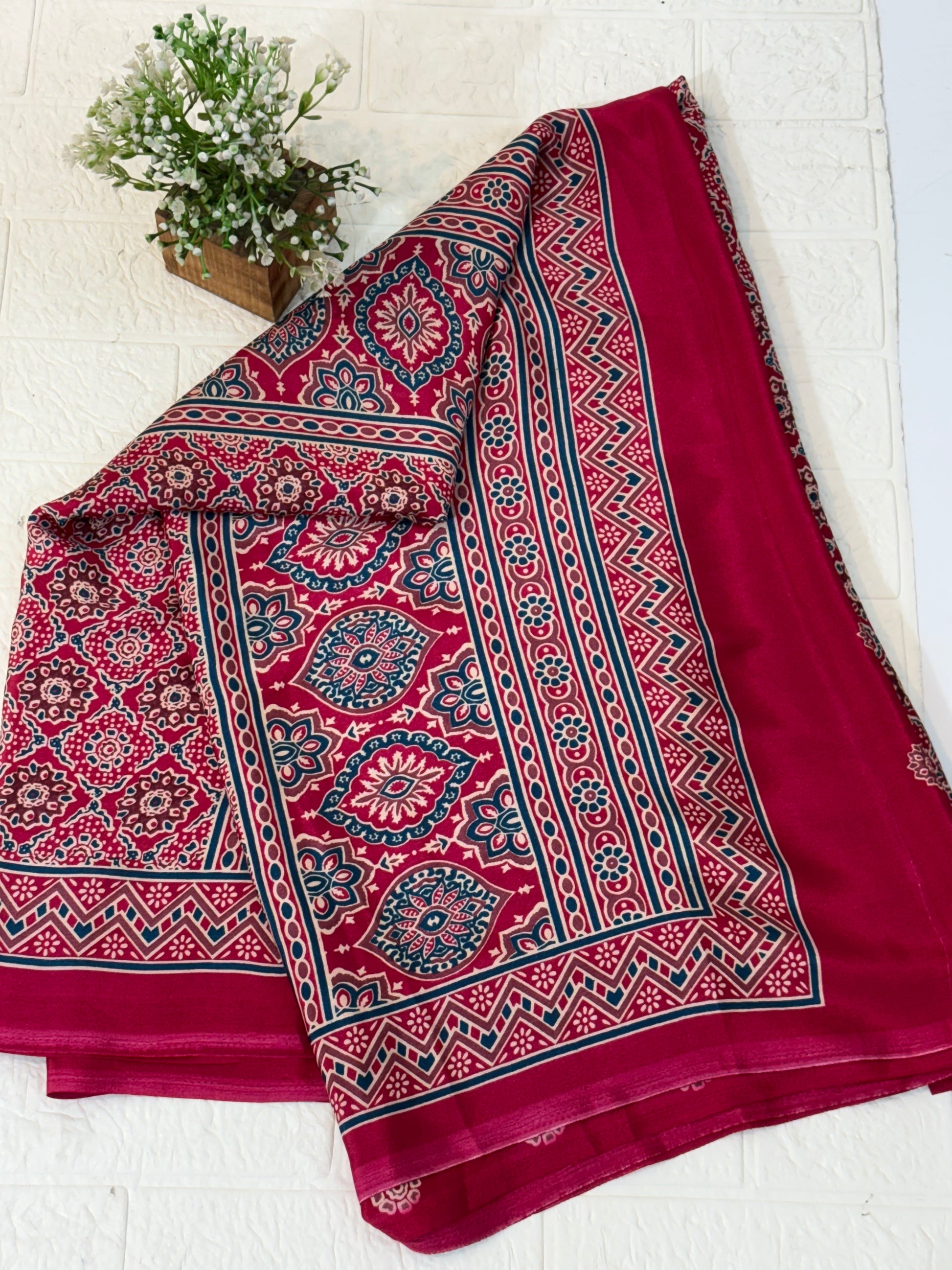 Maroon Ajrakh Motif Saree
Crafted in soft crepe fabric, this saree features traditional Ajrakh-inspired geometric prints with a classic border, offering comfort with timeless ethnic charm.