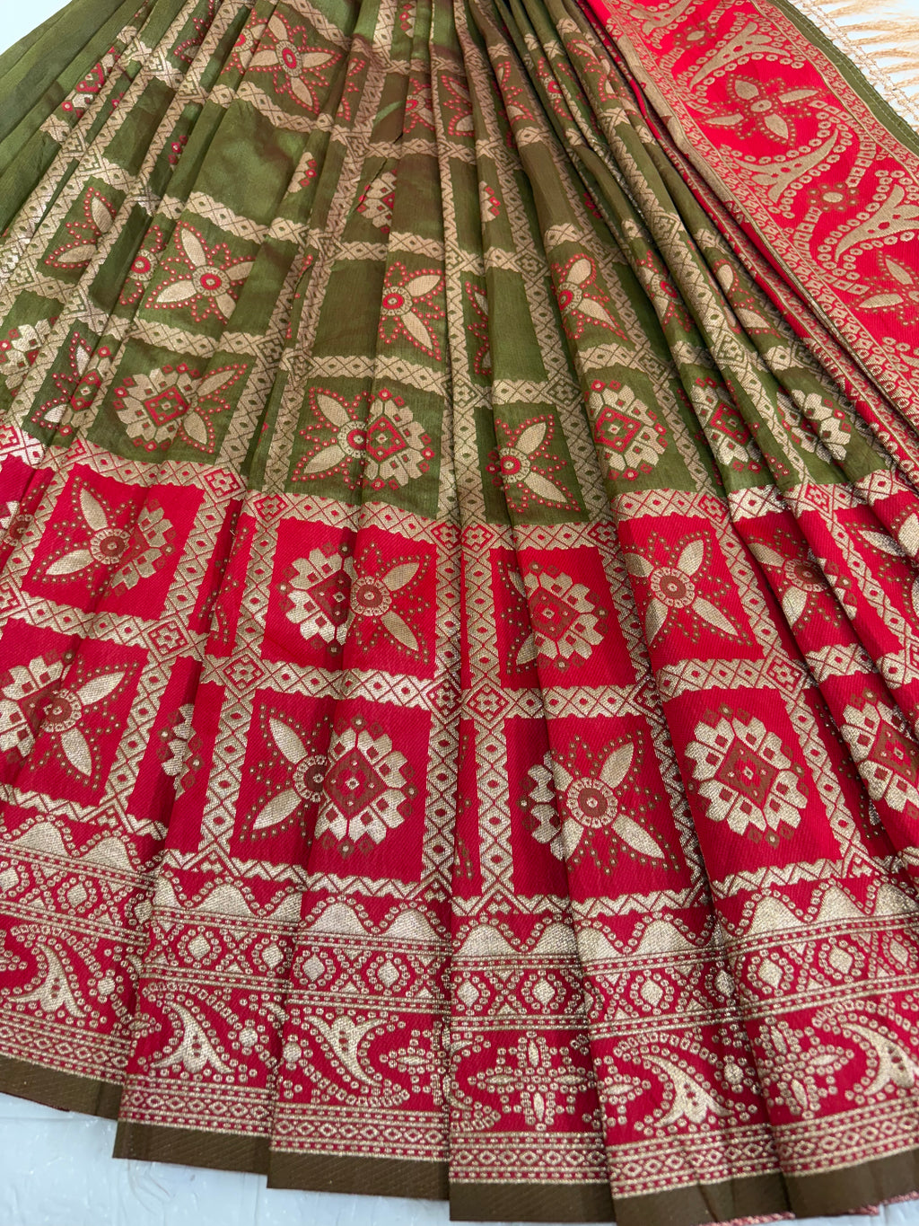 Name: Olive green Saree
Fabric: Pure Art silk blend adorned with traditional block print motifs and a contrasting red border for a timeless ethnic appeal.
