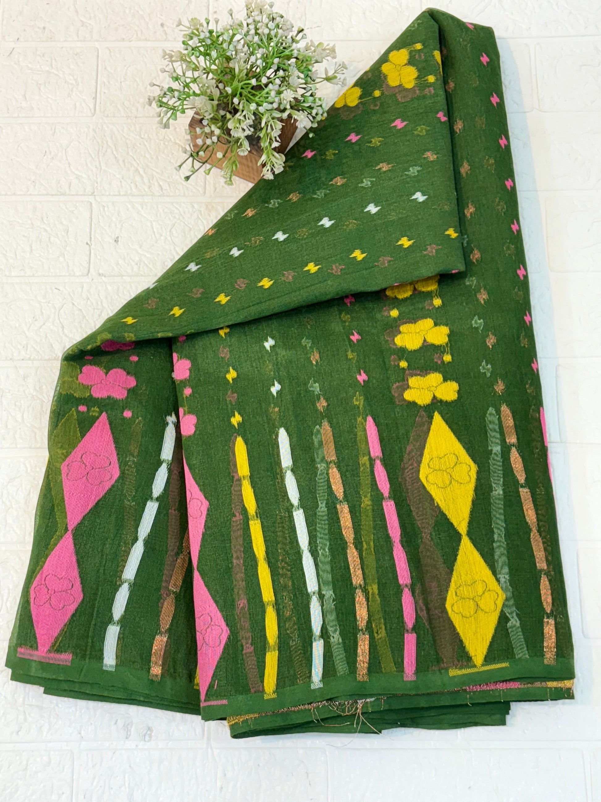 Soft cotton Jamdani, adorned with delicate floral motifs and a traditional woven border, light and breathable for all-day elegan