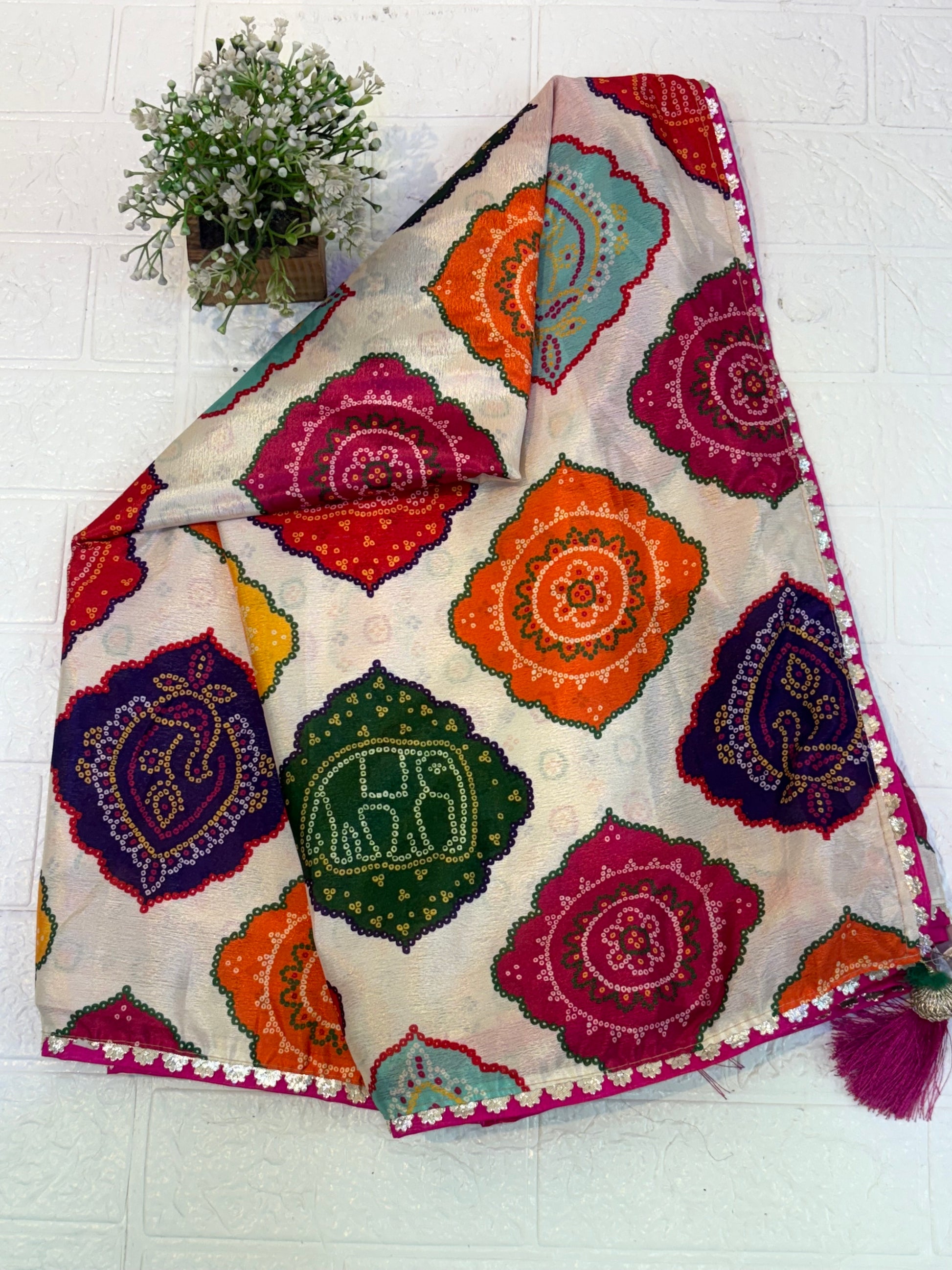 Name: Multicolor Bandhani Print Saree chinon fabric blend with vibrant traditional bandhani motifs, offering a festive and colorful ethnic appeal.