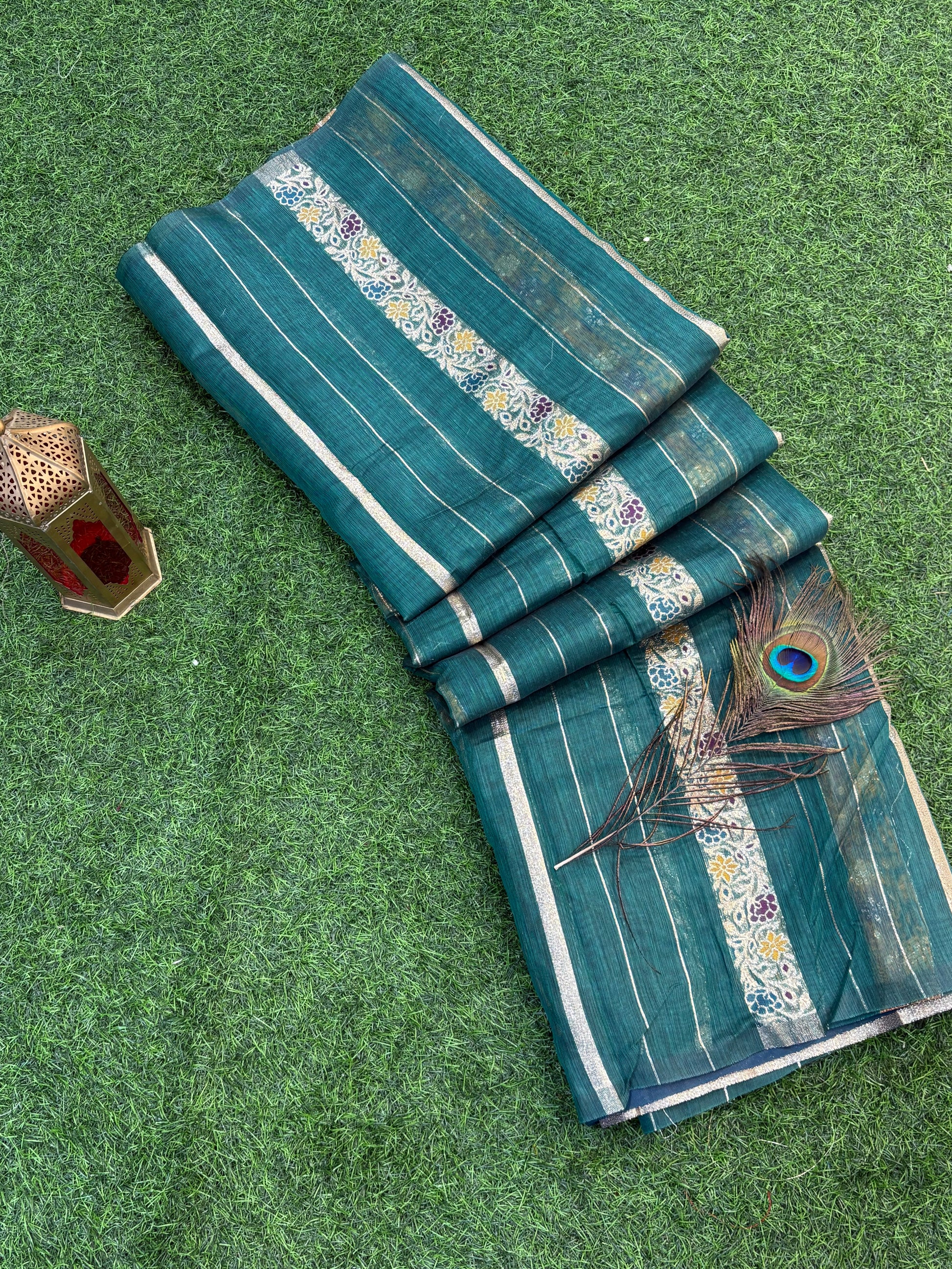 Teal green Garden Zari Classic Lightweight soft cotton saree featuring fine zari stripes, floral motif accents, and an elegant richly woven zari pallu and border.