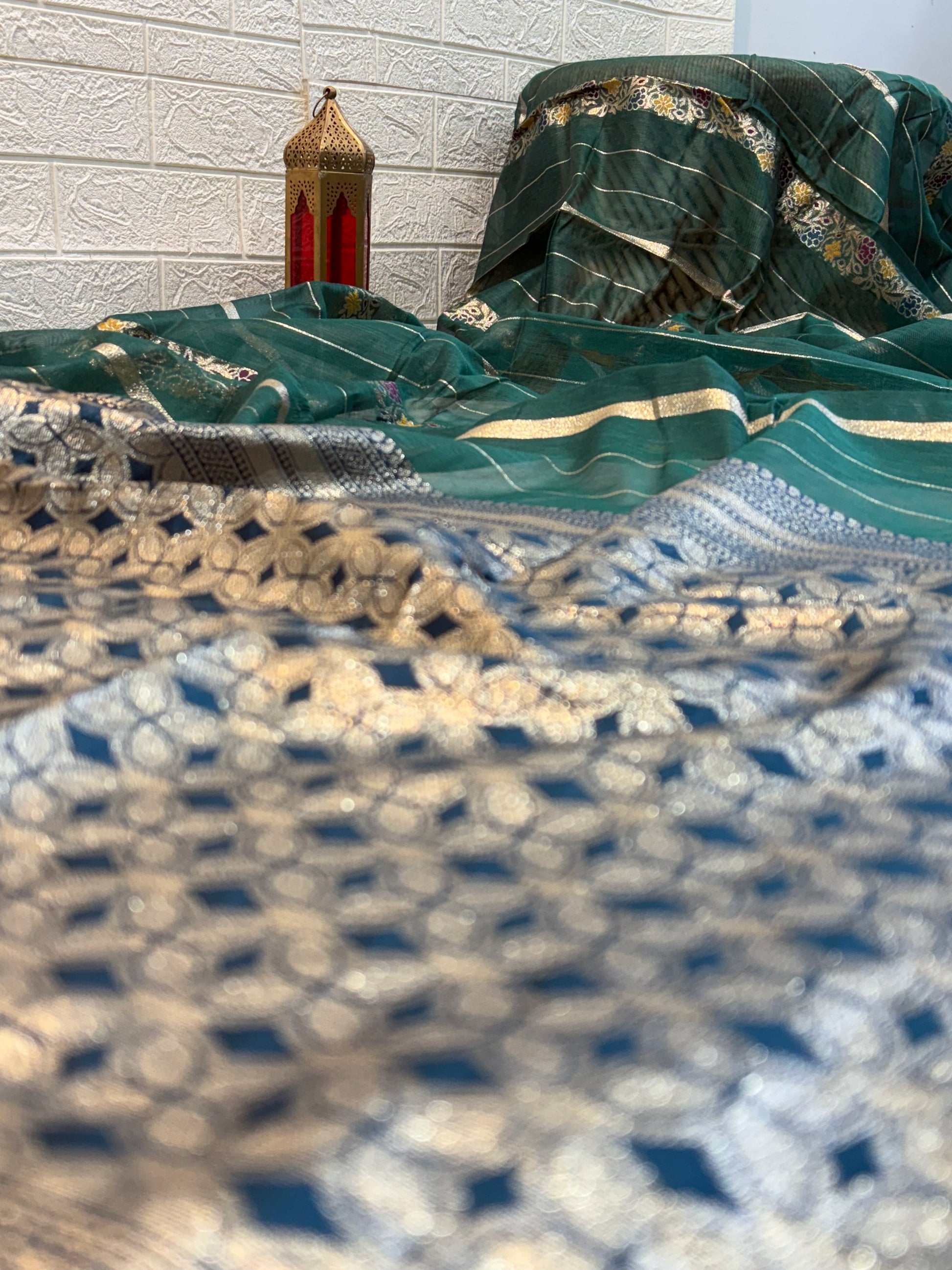 Teal green Garden Zari Classic Lightweight soft cotton saree featuring fine zari stripes, floral motif accents, and an elegant richly woven zari pallu and border.