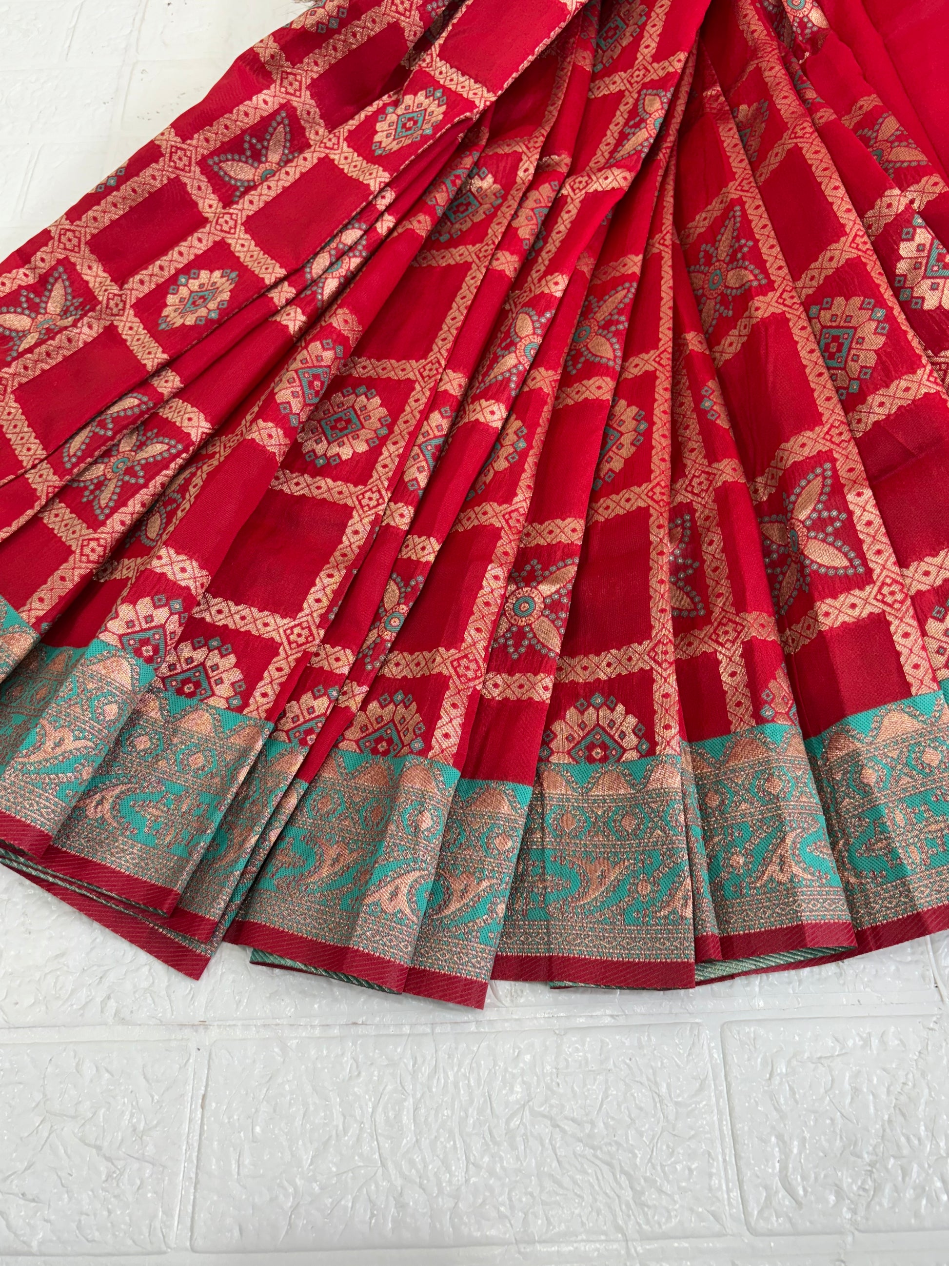 Name red saree fabric pure art silk blend adorned with traditional block print motifs and a contrasting tiffany blue border for a timeless ethnic appeal