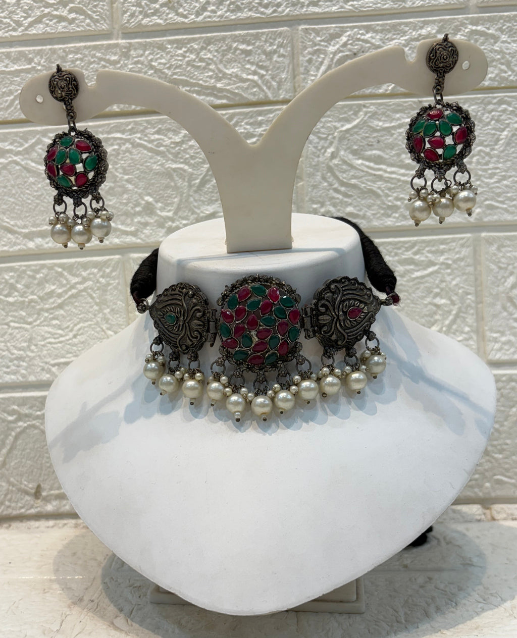 Name: Kundan Stone Oxidized Choker Set German silver with red-green Kundan work and pearl drop embellishments