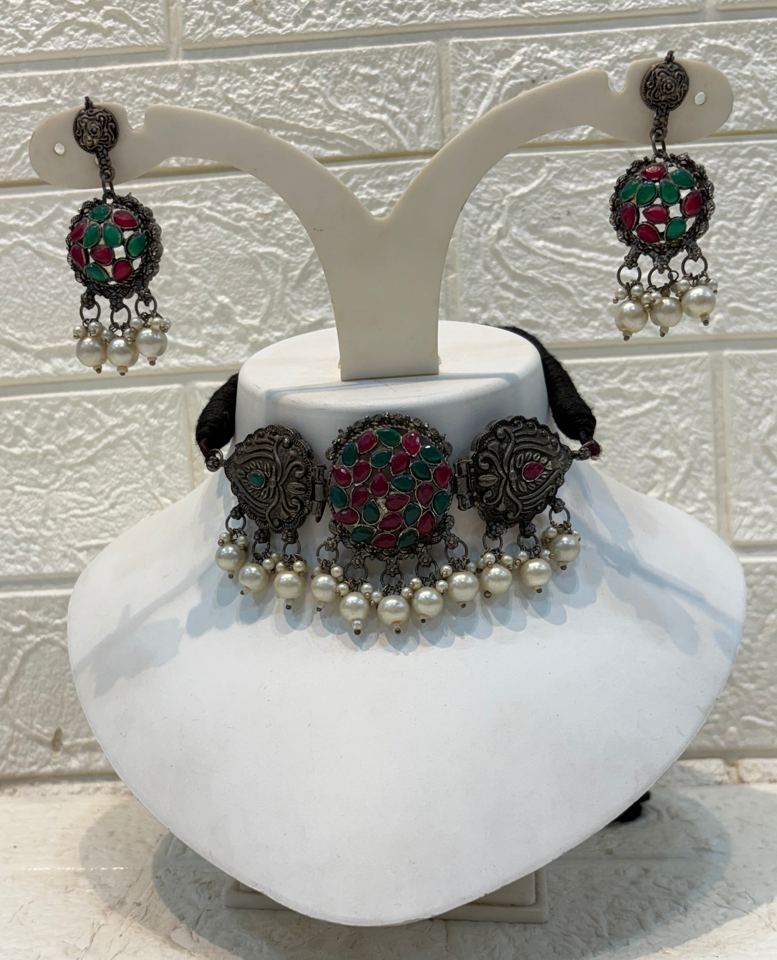 Name: Kundan Stone Oxidized Choker Set German silver with red-green Kundan work and pearl drop embellishments