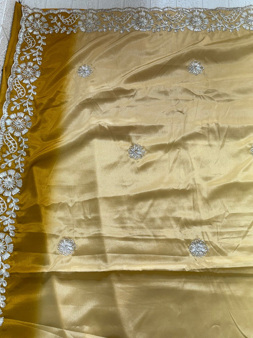 Name: Golden Embroidered Saree with crepe silk intricate white floral gota Patti lace work in silver colour embroidery on the border and motifs across the drape.