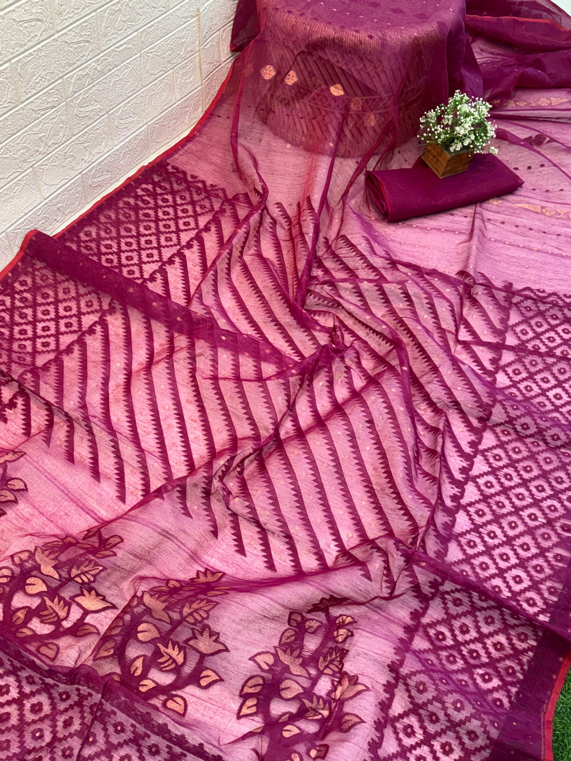 Dark purple Jamdani Saree
cotton, featuring rich geometric and floral woven motifs on a soft, sheer handloom base with an elegant traditional border.