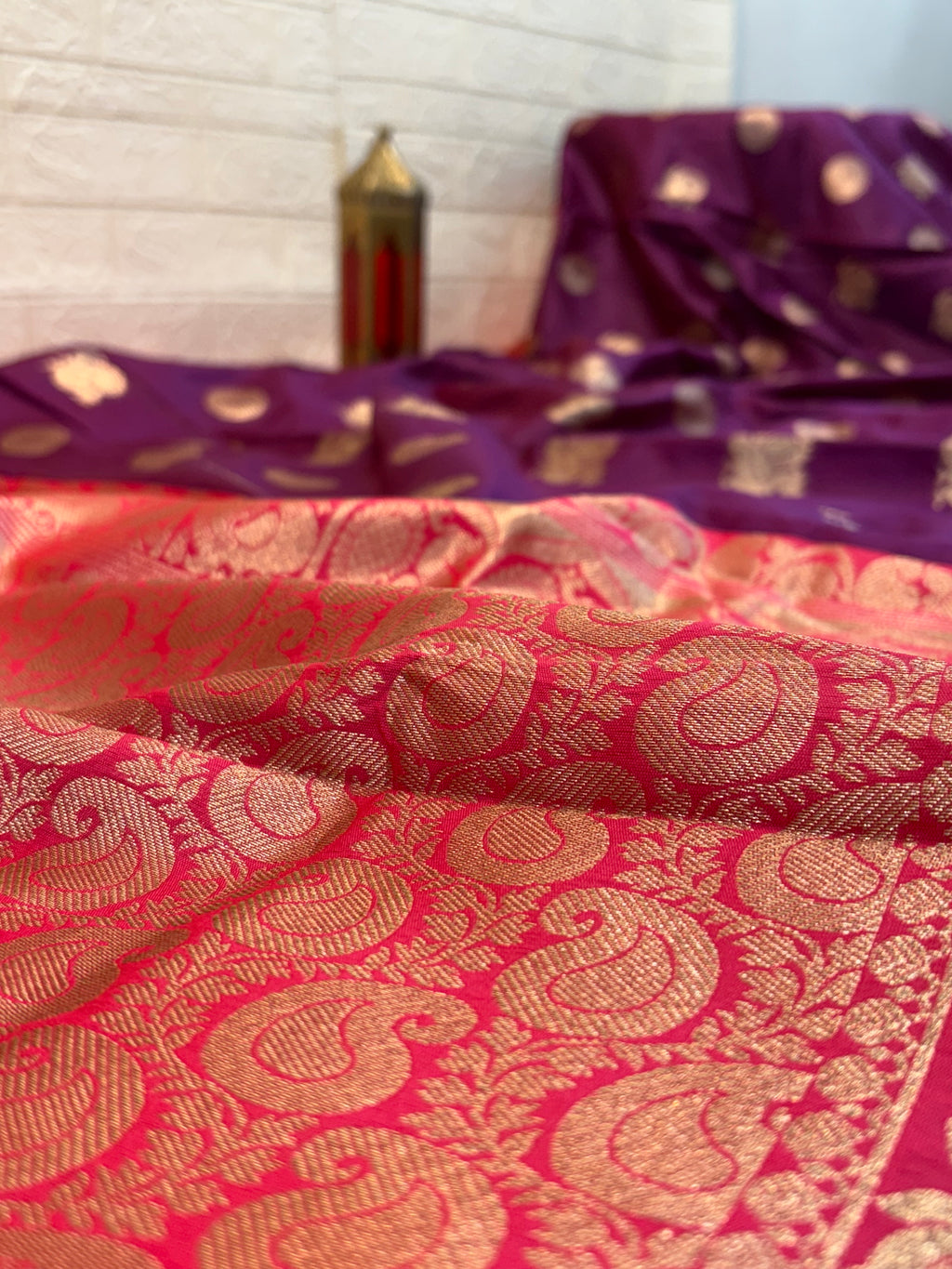 Royal Purple Zari Charm
Luxurious Banarasi silk saree adorned with elegant gold zari butti motifs and a rich contrast zari-woven border, perfect for weddings and festive occasions.