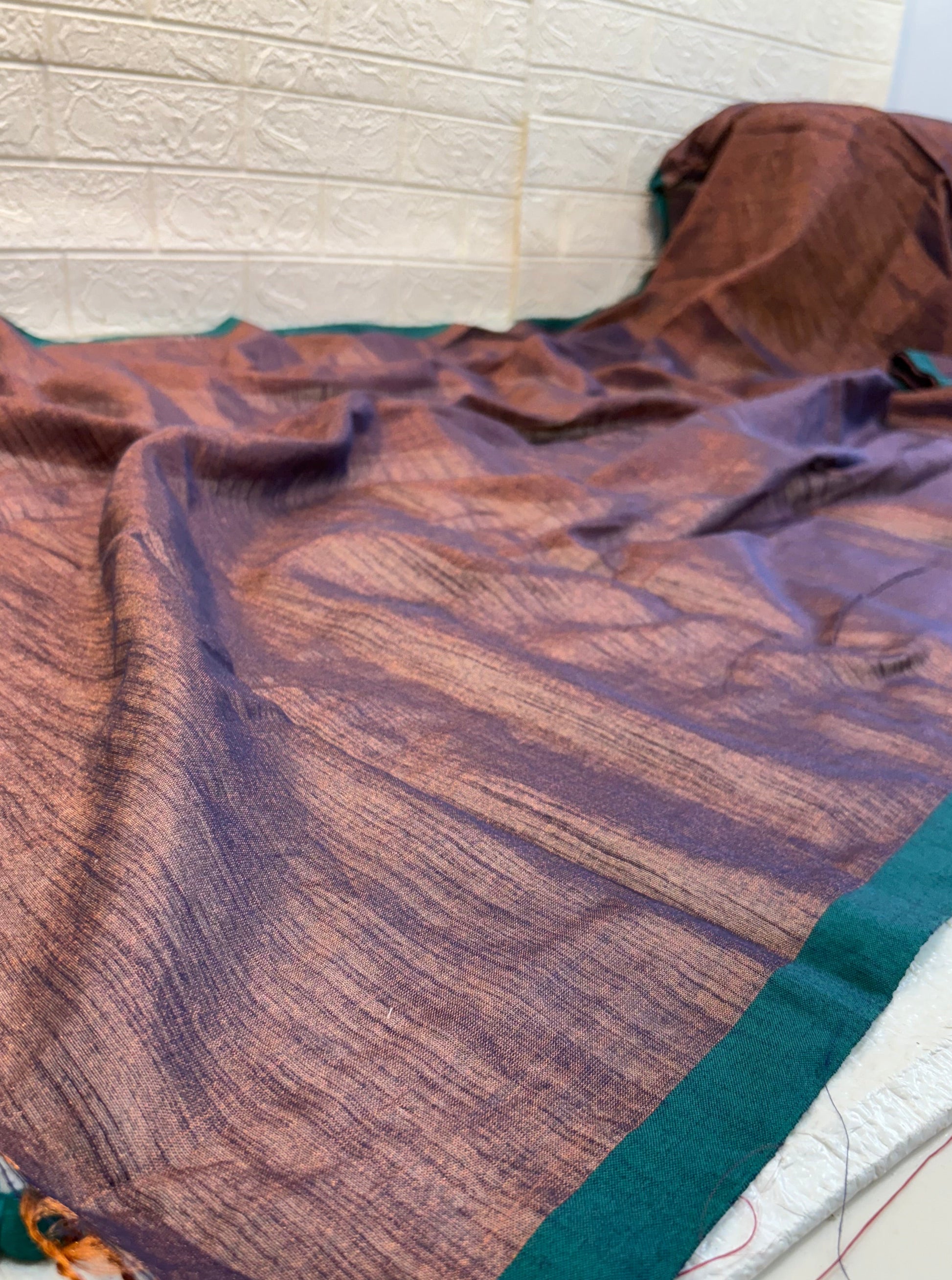 Name: Dual Tone  cotton shimmering Silk Saree Pure with a subtle copper and violet sheen, featuring a green border.