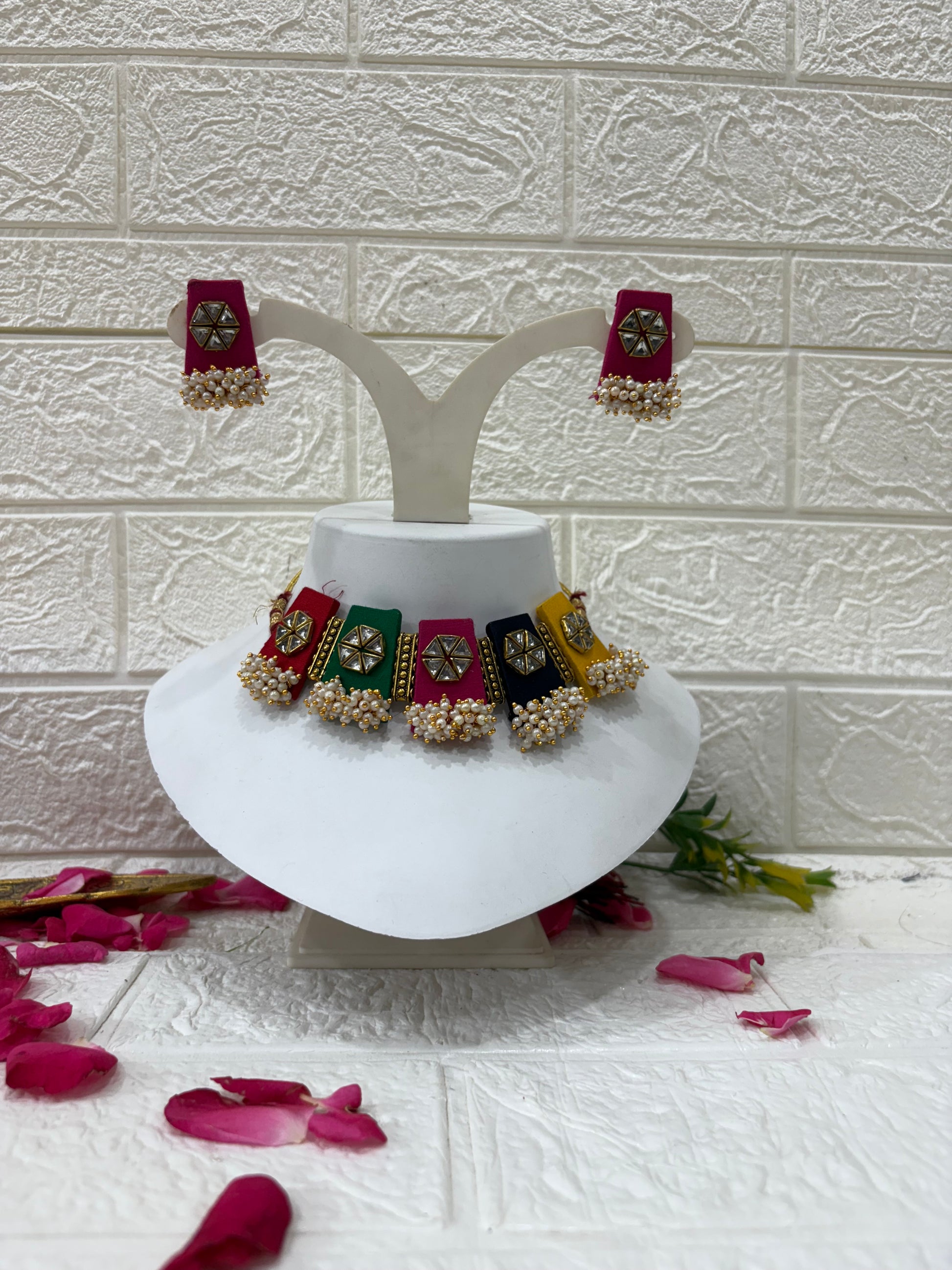 Multicolor Fabric Choker Set with Mirror Work & Pearl Drops

Collection:
Festive & Navratri Special Jewelry Collection

This name highlights the multicolor panels, mirror detailing, and pearl embellishments — making it perfect for traditional, festive, or