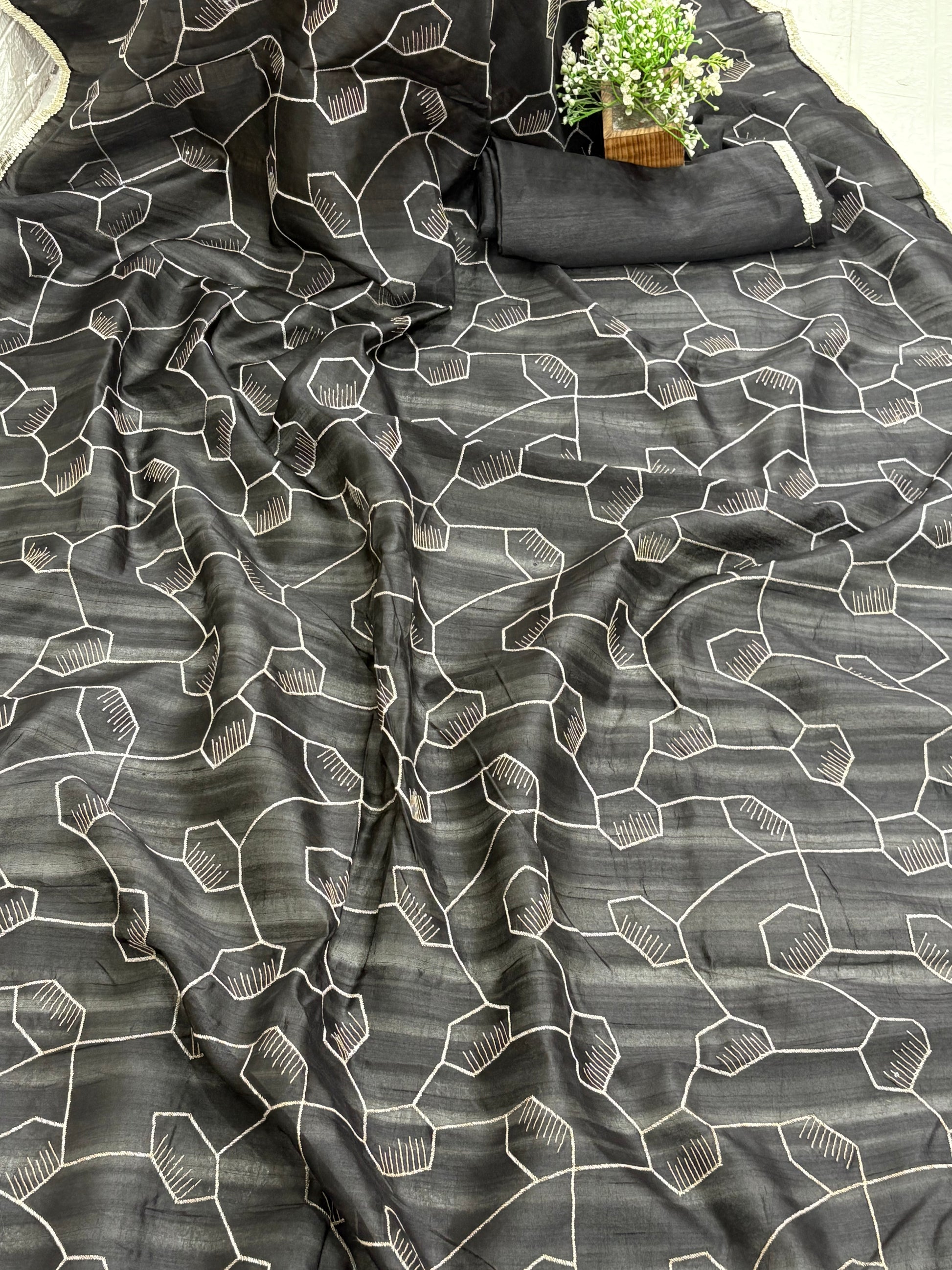 Black Saree This appears to be a silk Blend saree Cotton Silk or Art Silk with a modern Geometric Hexagonal Weave or Jaal design.