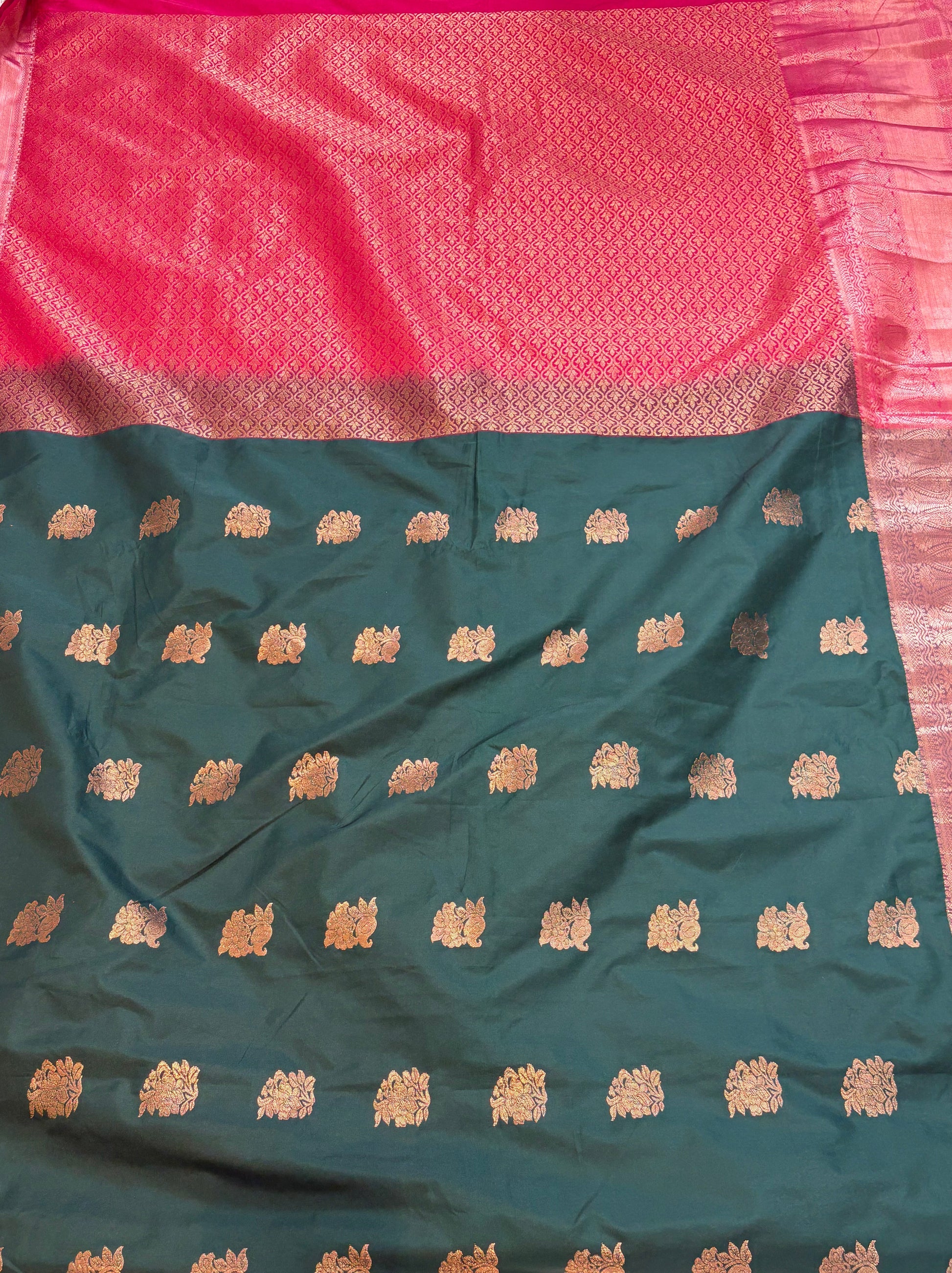 Name: soft silk with rich zari weaving in dark green and maroon contrast copper colour border and pallu.