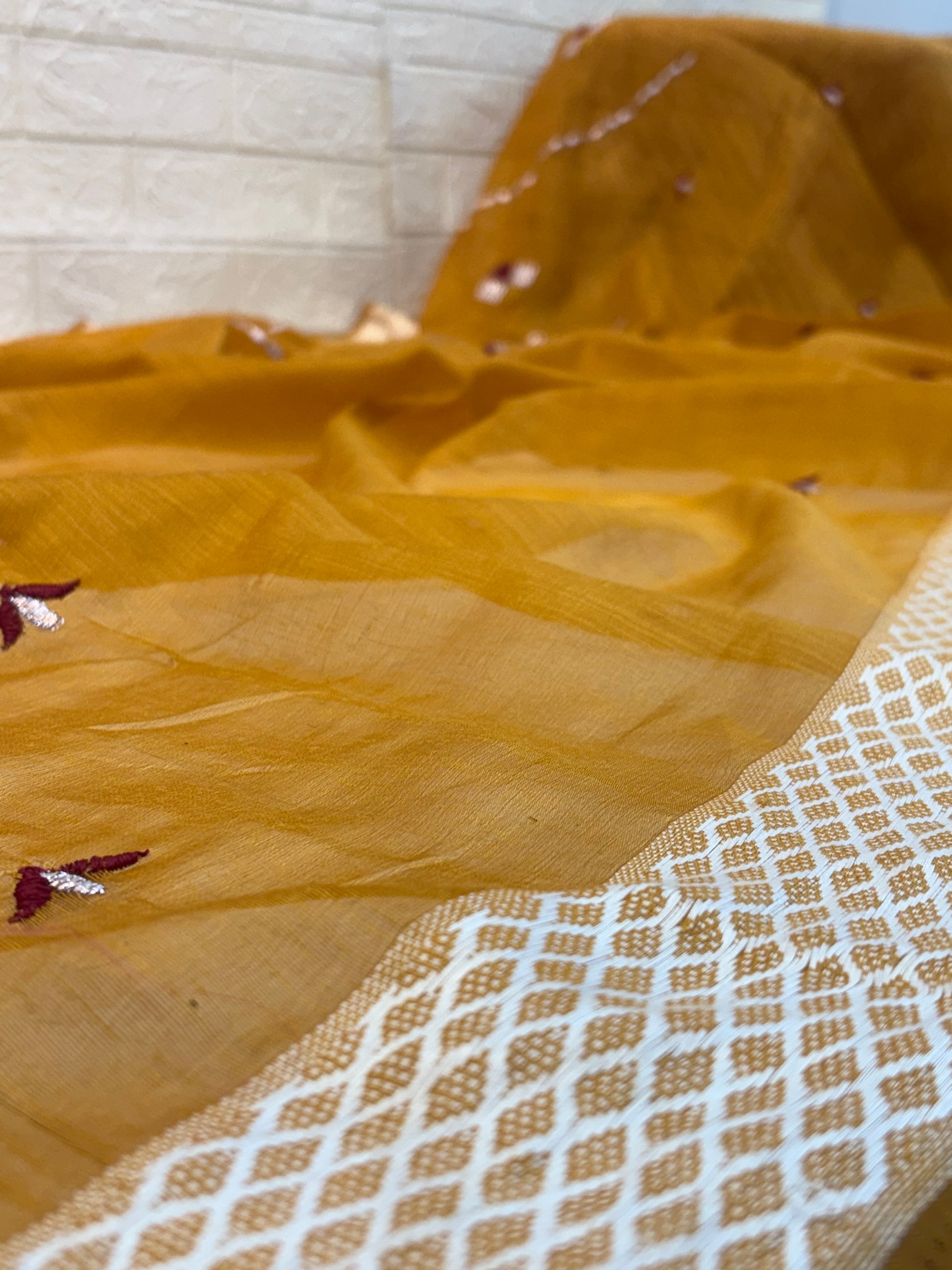 Yellow Mustard Handloom Saree handwoven cotton highlighted with subtle embroidered motifs and a classic textured border for an elegant everyday look.