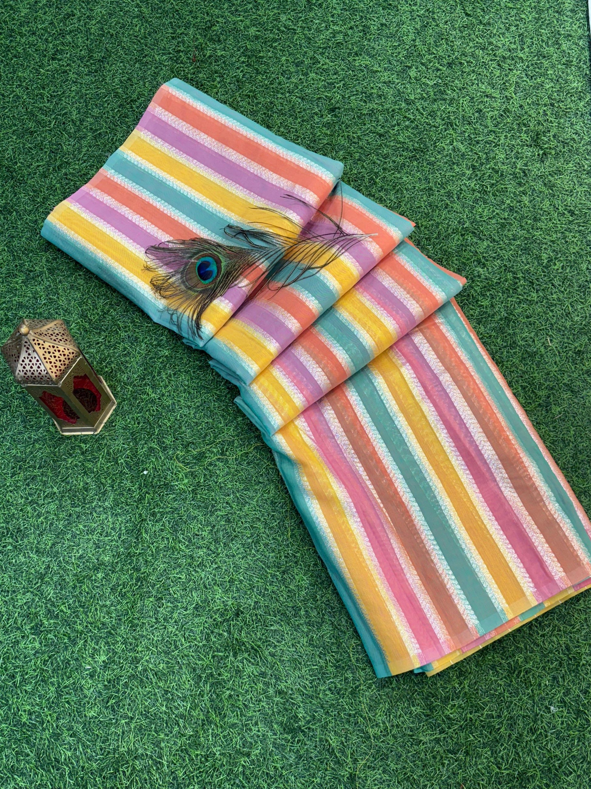 Rainbow Pastel Zari Stripe
Lightweight soft cotton saree with vibrant multicolor zari stripes and a soft pink richly woven zari border, perfect for festive and daytime occasions.