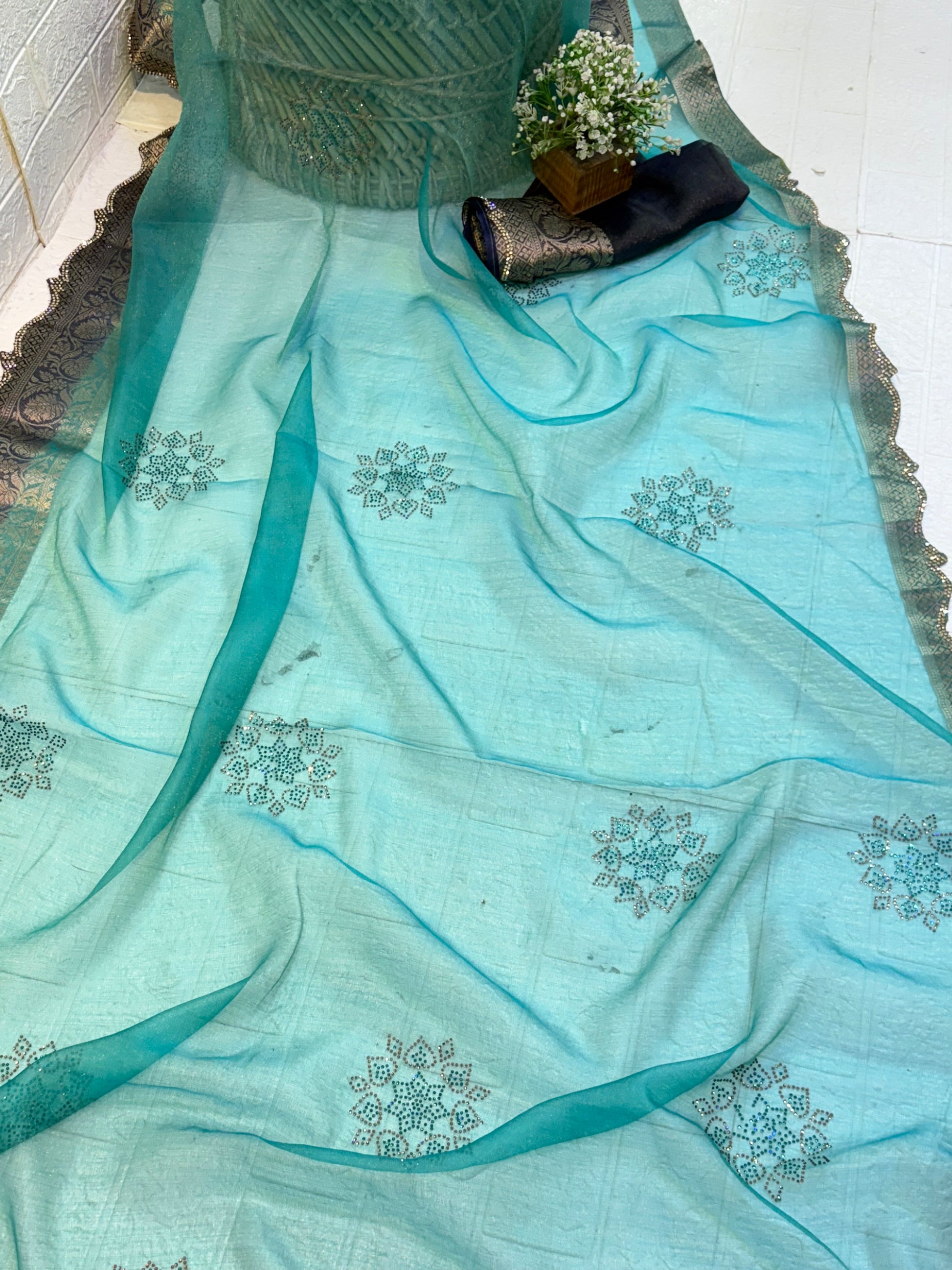 Name: Sea Green cotton silk Saree Lightweight silk with intricate sequin floral motifs and rich zari-woven border, perfect for elegant festive wear.