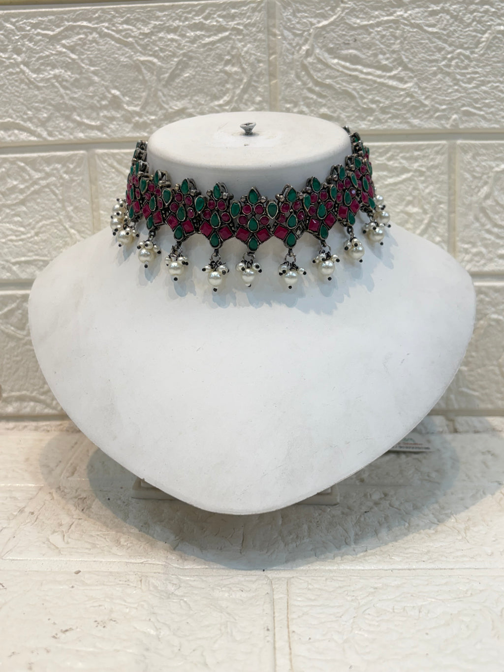 Name: Traditional Kundan Choker Necklace Set Oxidized silver metal with red-green stone inlay and silver bead drops