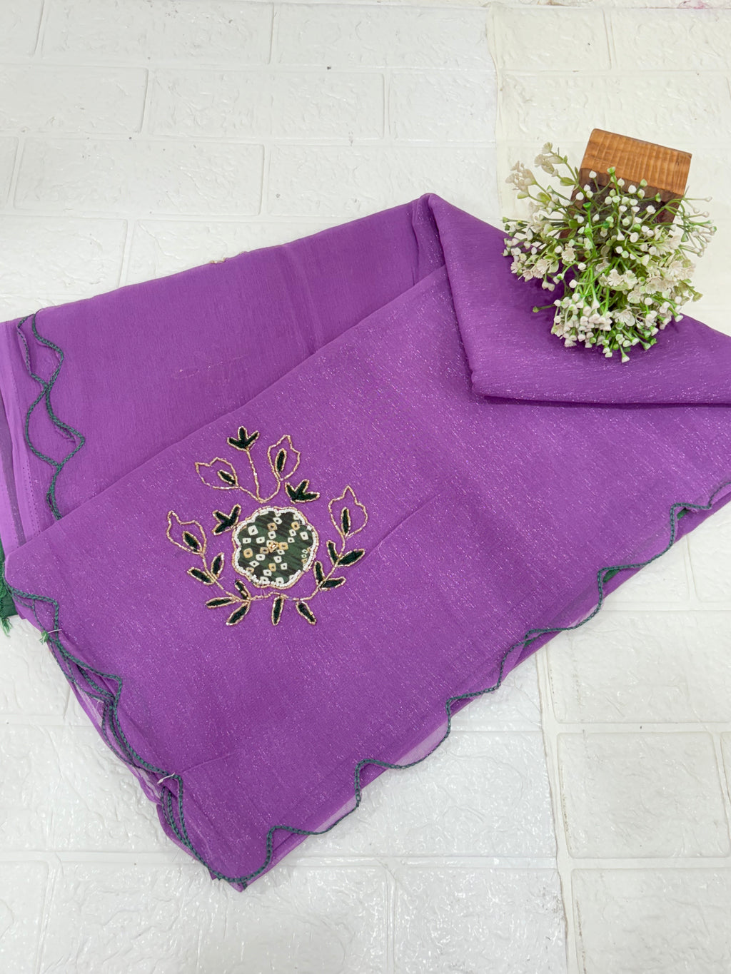 Name: Lavender Charm Ensemble Lightweight soft  shimmer organza fabric with delicate thread embroidery and shimmer detailing, paired with a Green blouse and a giving it a graceful drape