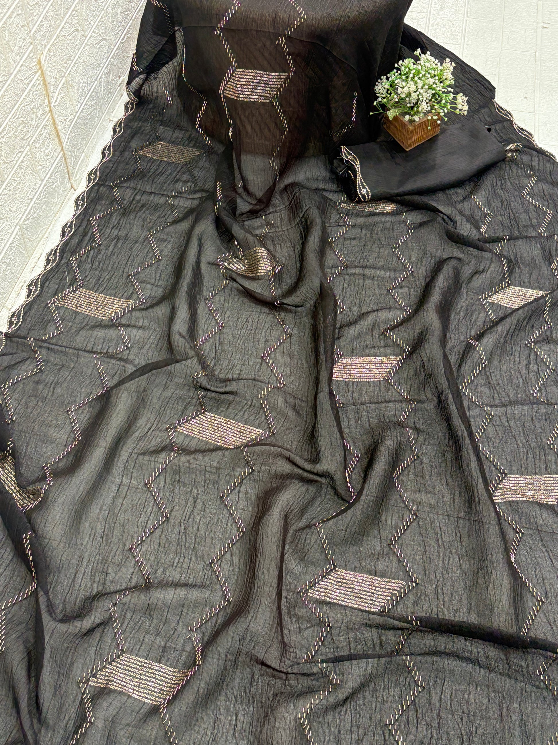 Name: Black Zigzag Embroidered Saree
Fabric: Lightweight crepe georgette with metallic thread embroidery