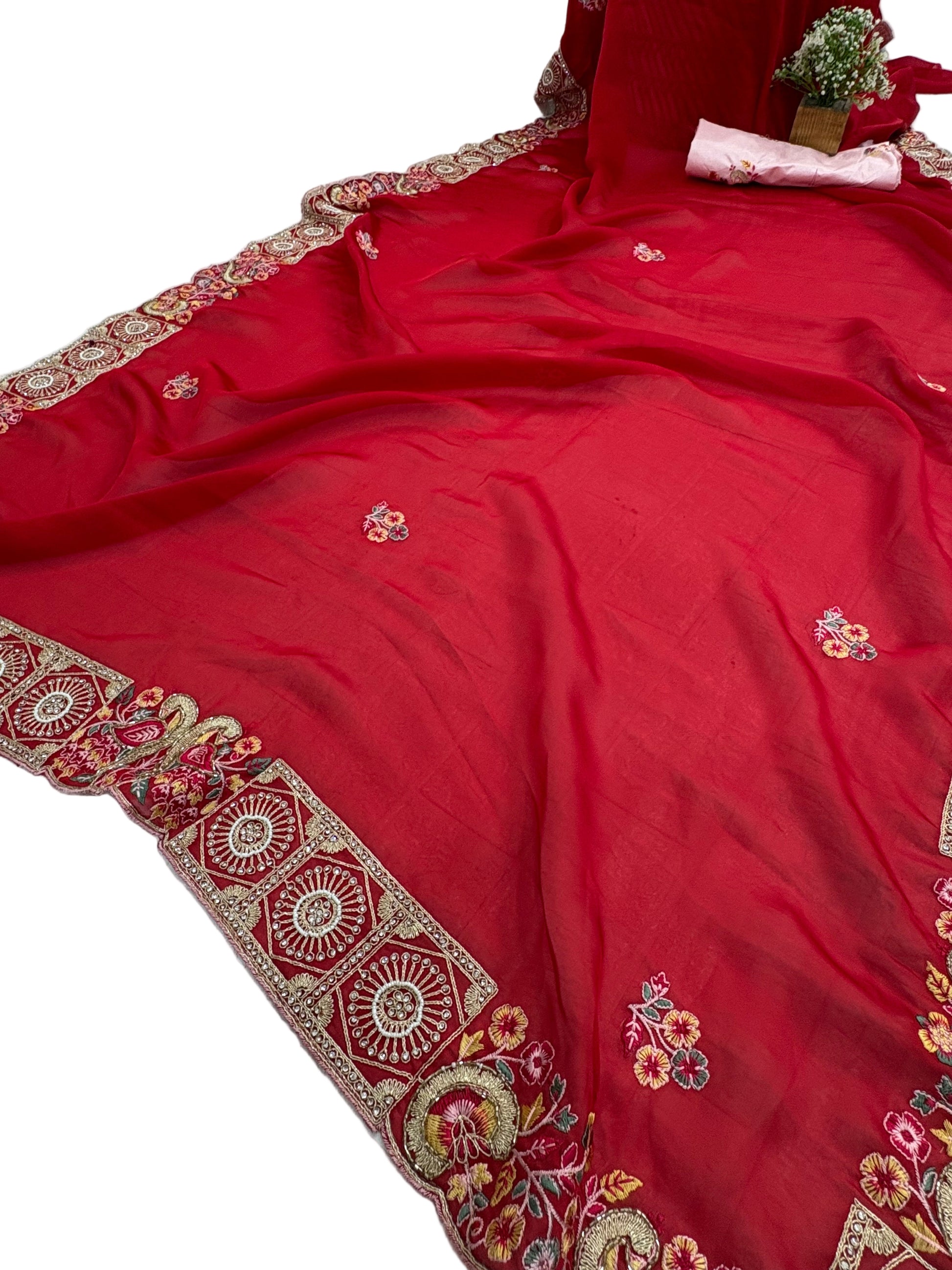 Name: Crimson Blossom saree Lightweight chiffon red colour with delicate floral embroidery and intricate border detailing.