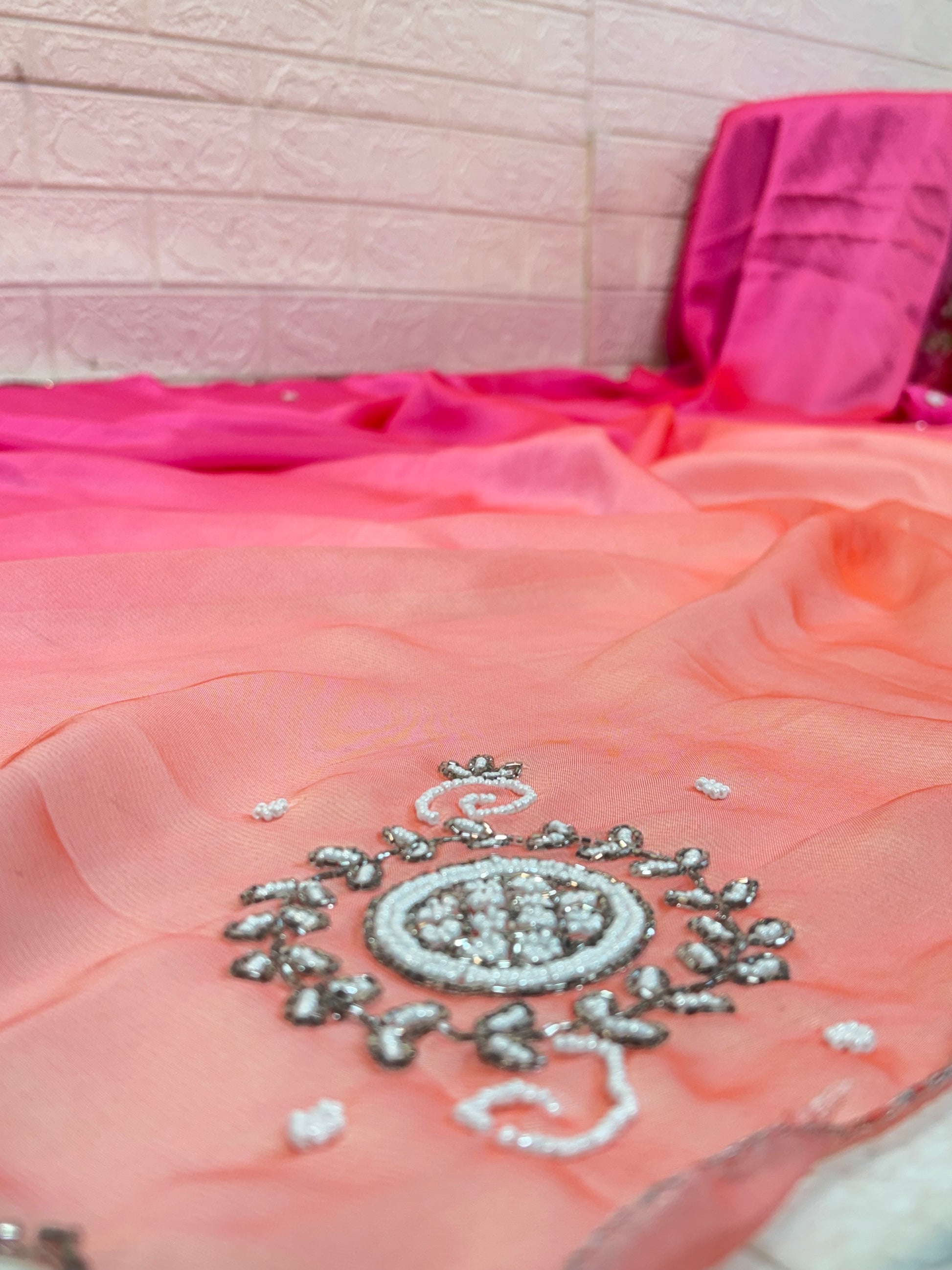 Rose Ombre Pearl Saree
Crafted in lightweight soft crepe fabric, this saree features a graceful two shaded saree pink-to-peach ombre finish with delicate pearl butti work for an elegant, flowy look.