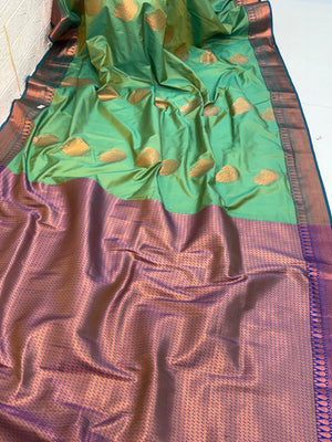 Name: Green pure Silk Saree with Rich Zari Weaving and purple pallu and contrast Border