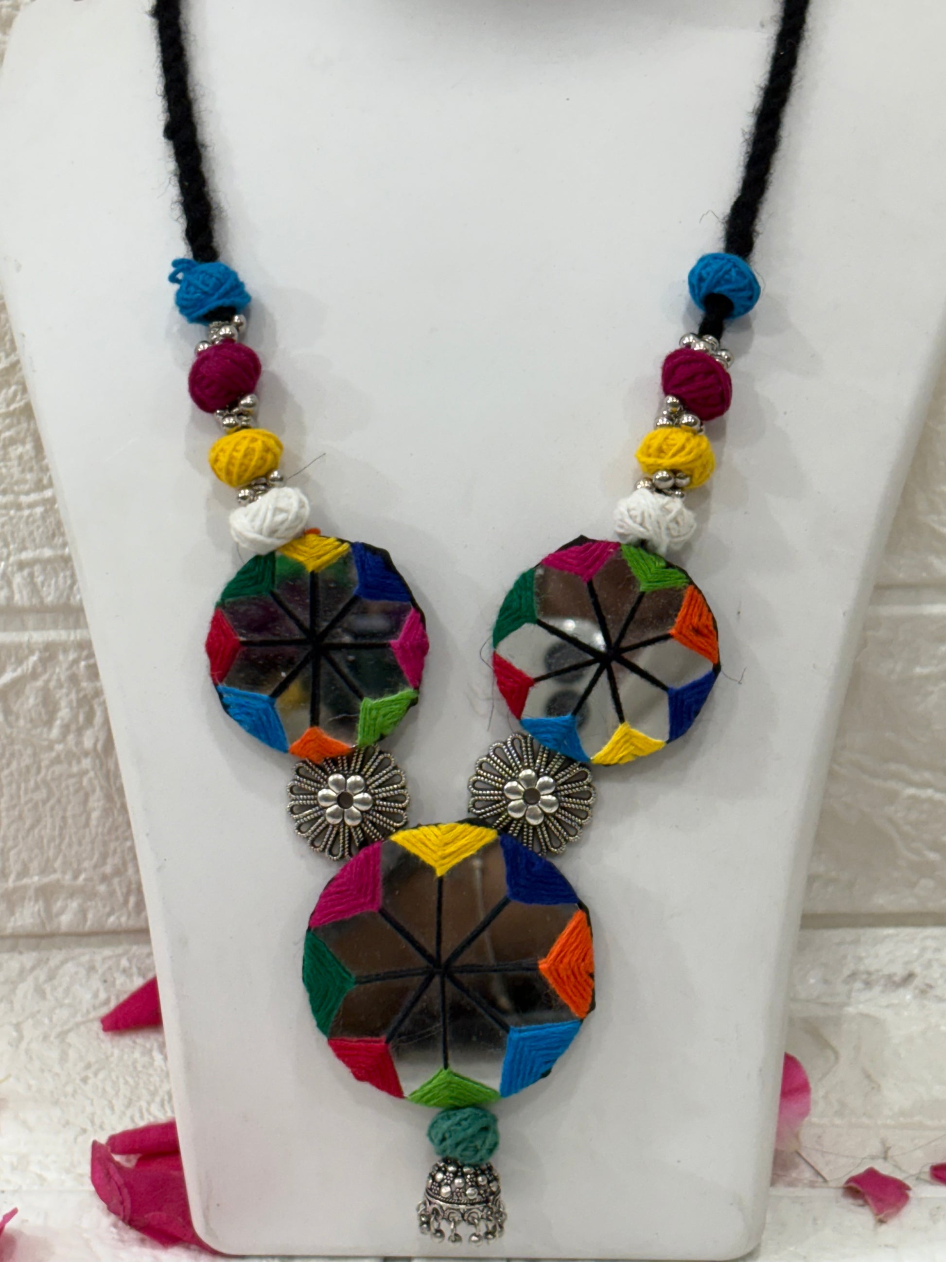 Name:
Multicolor Mirror Work Thread Necklace Set with Earrings

Collection:
Navratri & Festive Jewelry Collection
(or you could call it Boho Mirror Work Collection if you want a more trendy vibe)