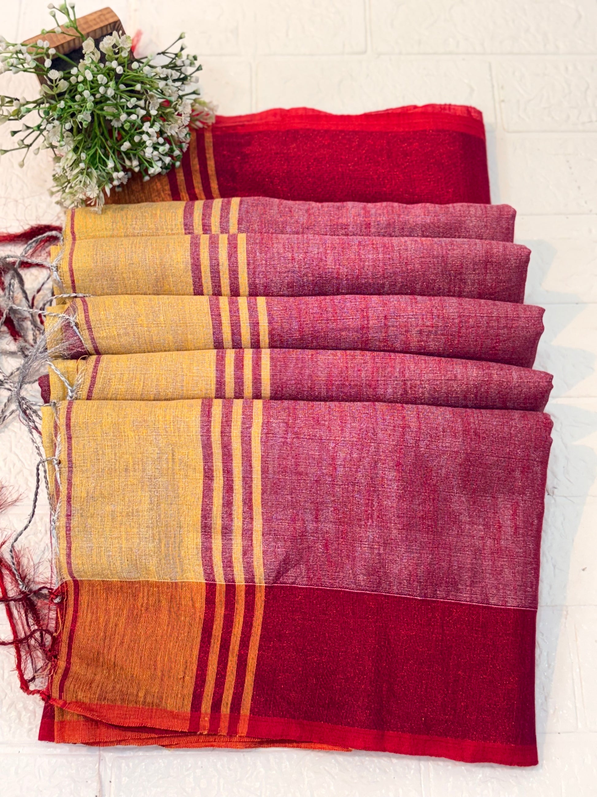 Name: Dual Shade Mustard and Maroon cotton shimmering Saree with a rich mustard body and maroon pallu, accented by a subtle border.