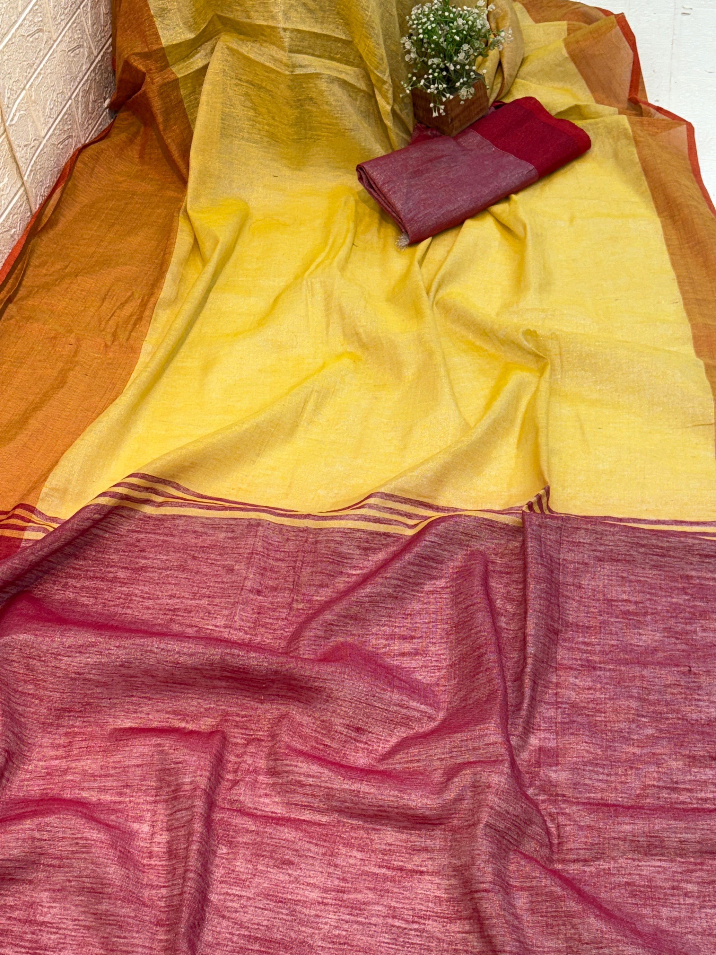 Name: Dual Shade Mustard and Maroon cotton shimmering Saree with a rich mustard body and maroon pallu, accented by a subtle border.