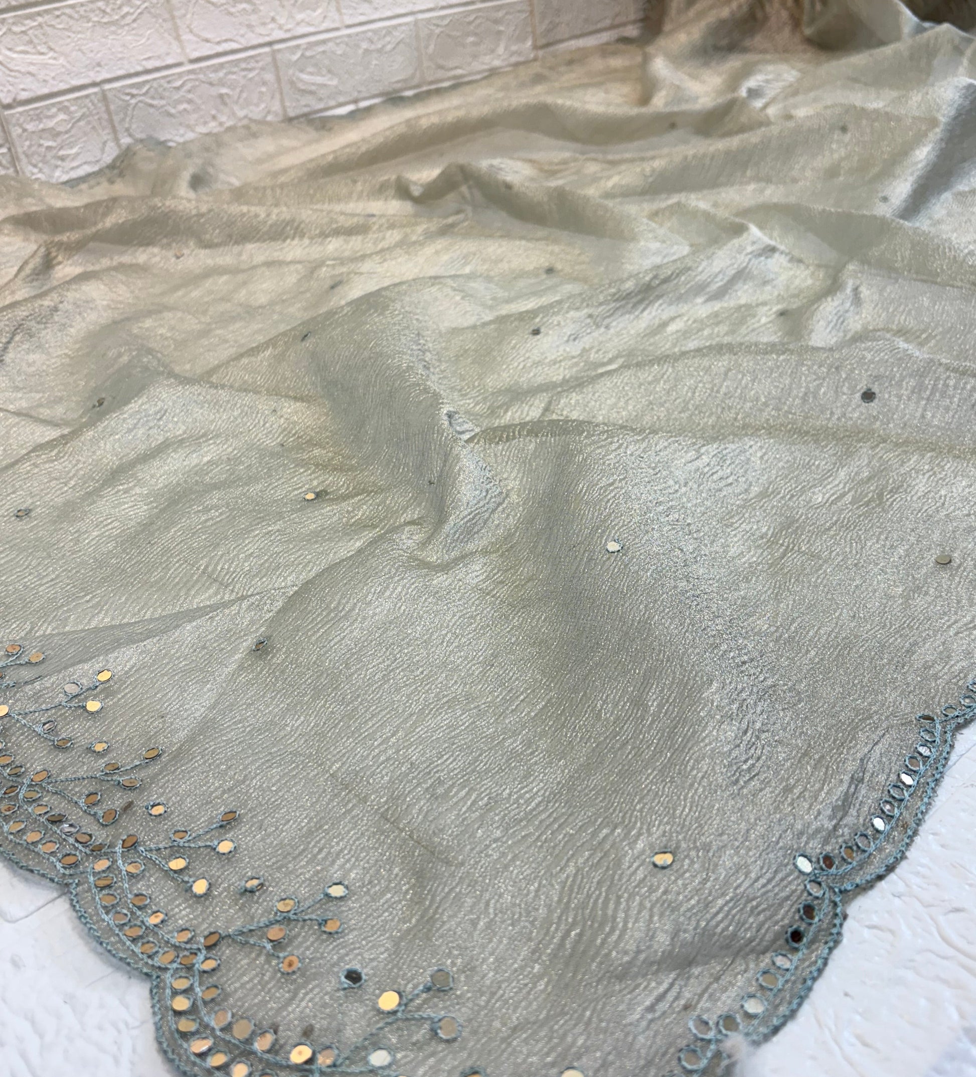 Name: Silver Grey Saree crust tissue fabric with Subtle Embellishments with delicate sequin detailing and scalloped embroidered border