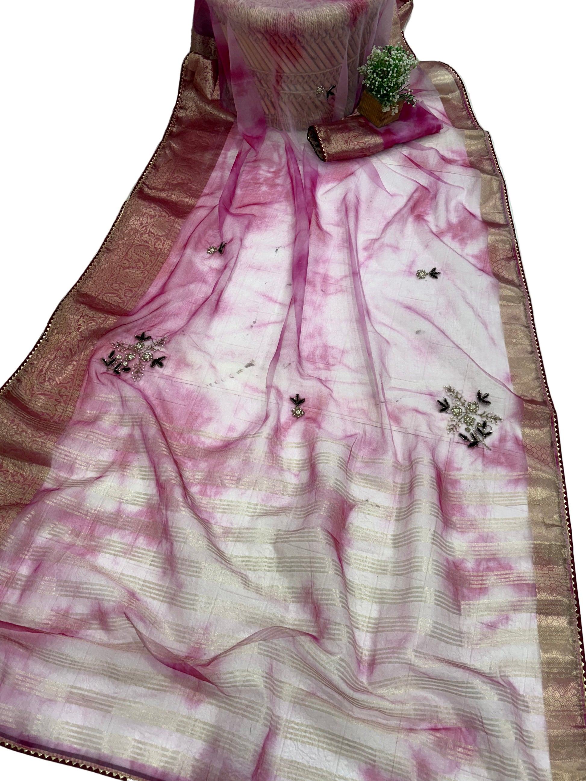 Name: Pink Ombre Organza Saree Soft organza with zari-woven golden border and delicate sequin floral embroidery, giving a graceful festive look.