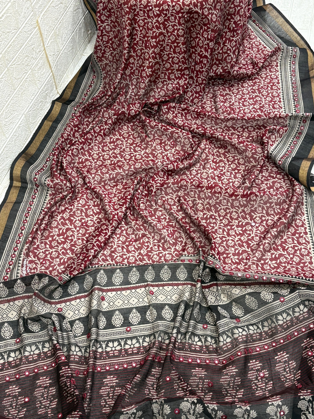 Name: Ebony Block Print Saree
Fabric: Pure cotton with traditional block print motifs, mirror embellishments, and a gold zari border for a classic ethnic charm.