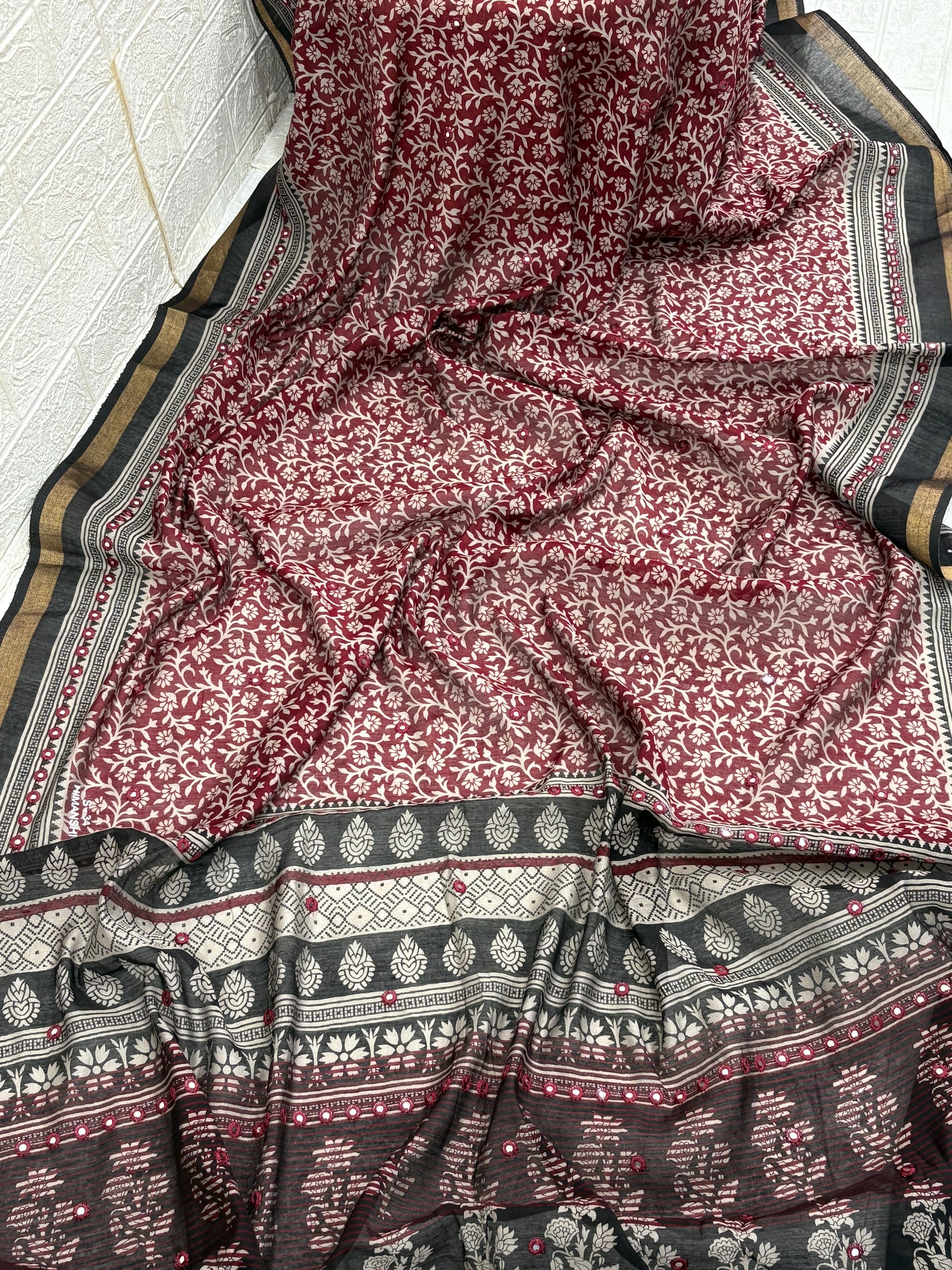 Name: Ebony Block Print Saree
Fabric: Pure cotton with traditional block print motifs, mirror embellishments, and a gold zari border for a classic ethnic charm.