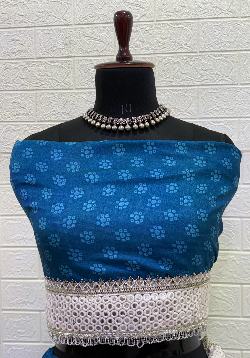 Name:  Blue Bandhani  Lehenga Set Made from soft cotton  Bandhani  print fabric with a mirror work border and paired with a chiffon white dupatta – perfect for festive and traditional celebrations.