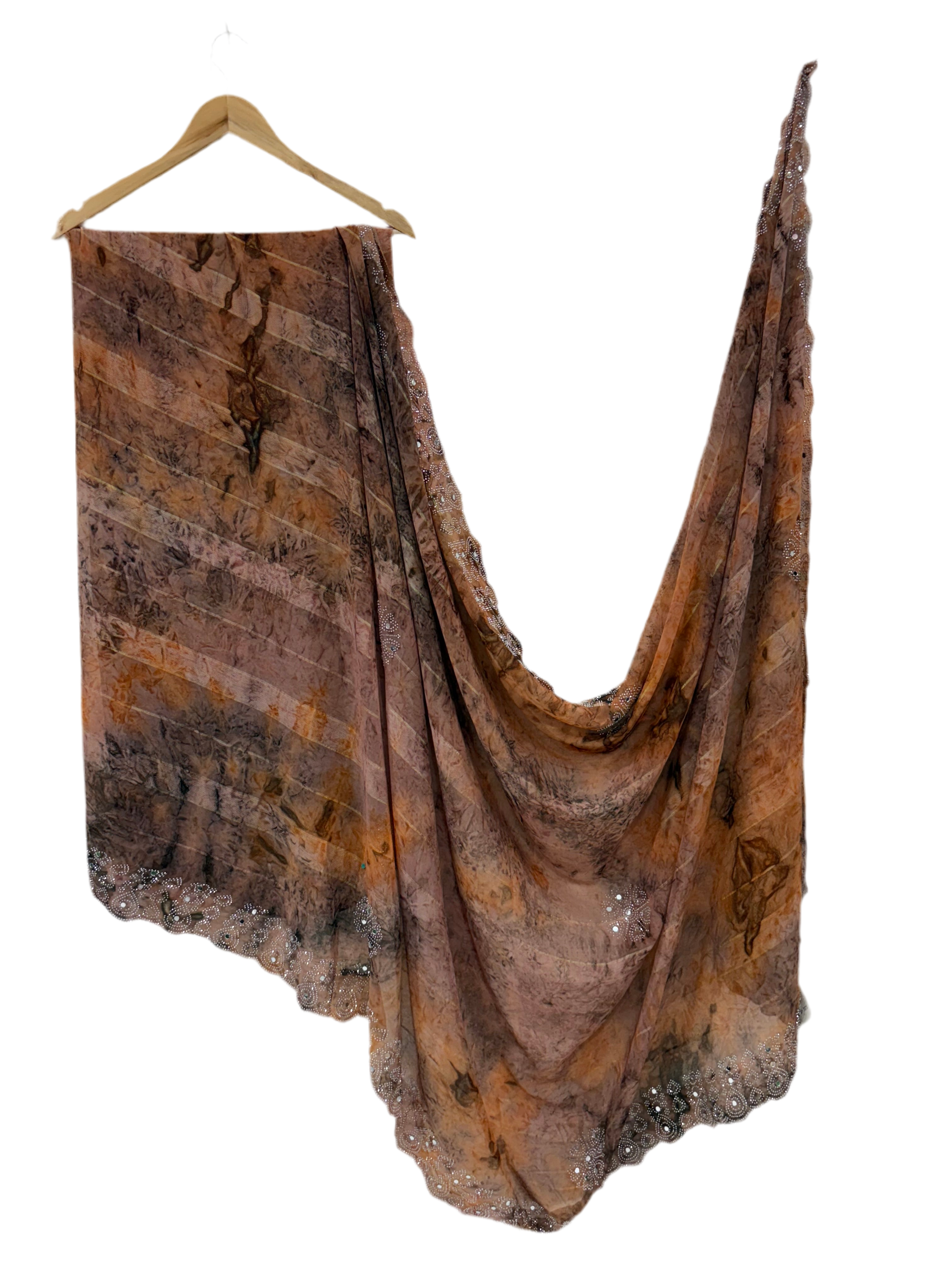 Saree with Woven mirror or peach and light black colour small motif The pattern is a  (motif) woven the sheer georgette fabric Silk.  with mirror work in saree This fabric is known for its sheer, lightweight texture