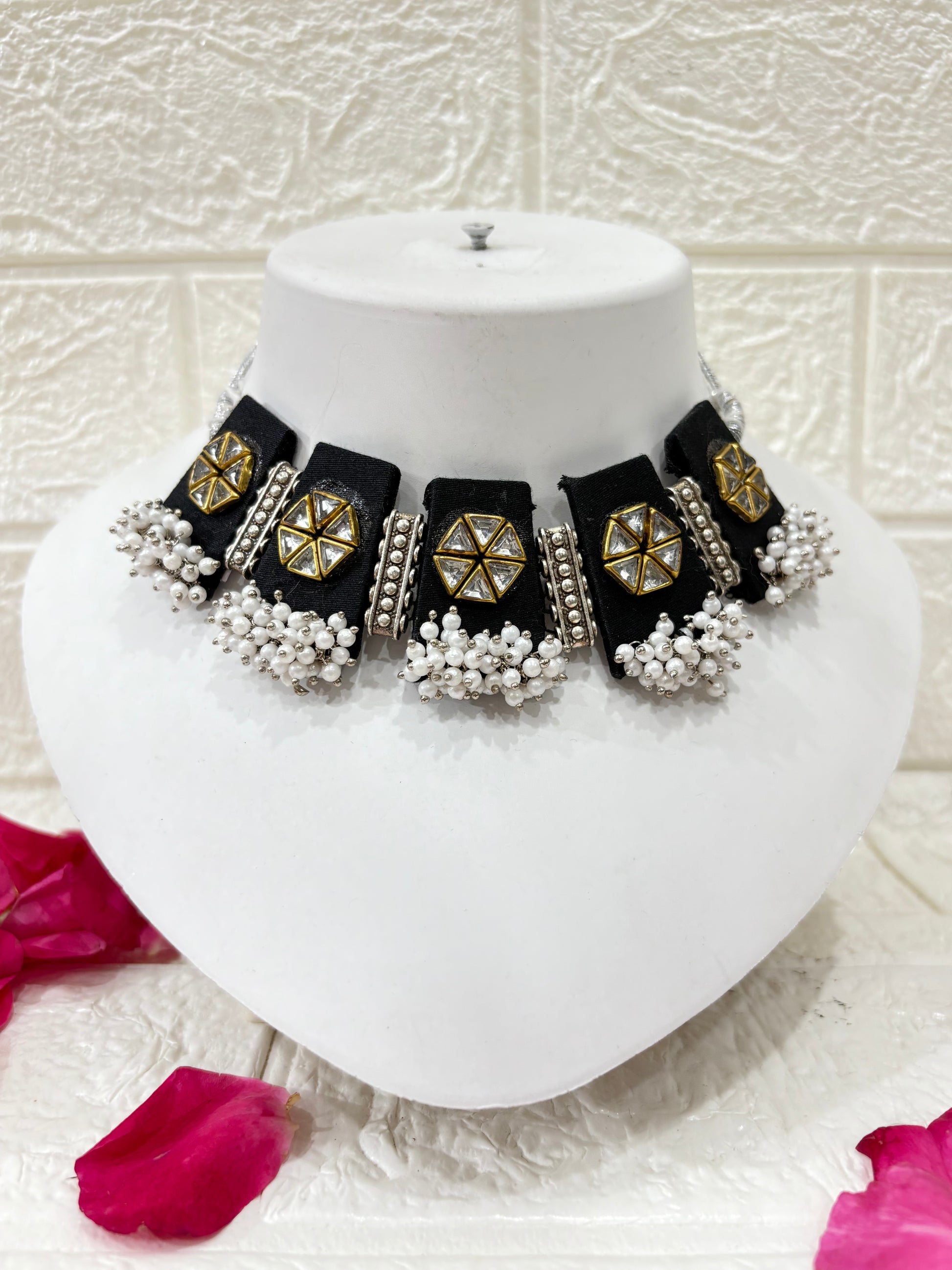 Name:
Black Fabric Choker Set with Mirror Work & Pearl Drops

Collection:
Festive & Wedding Jewelry Collection
(or if you want it more niche: Elegant Black Edit – Statement Jewelry Collection)

This will make it easy for customers to browse and also give