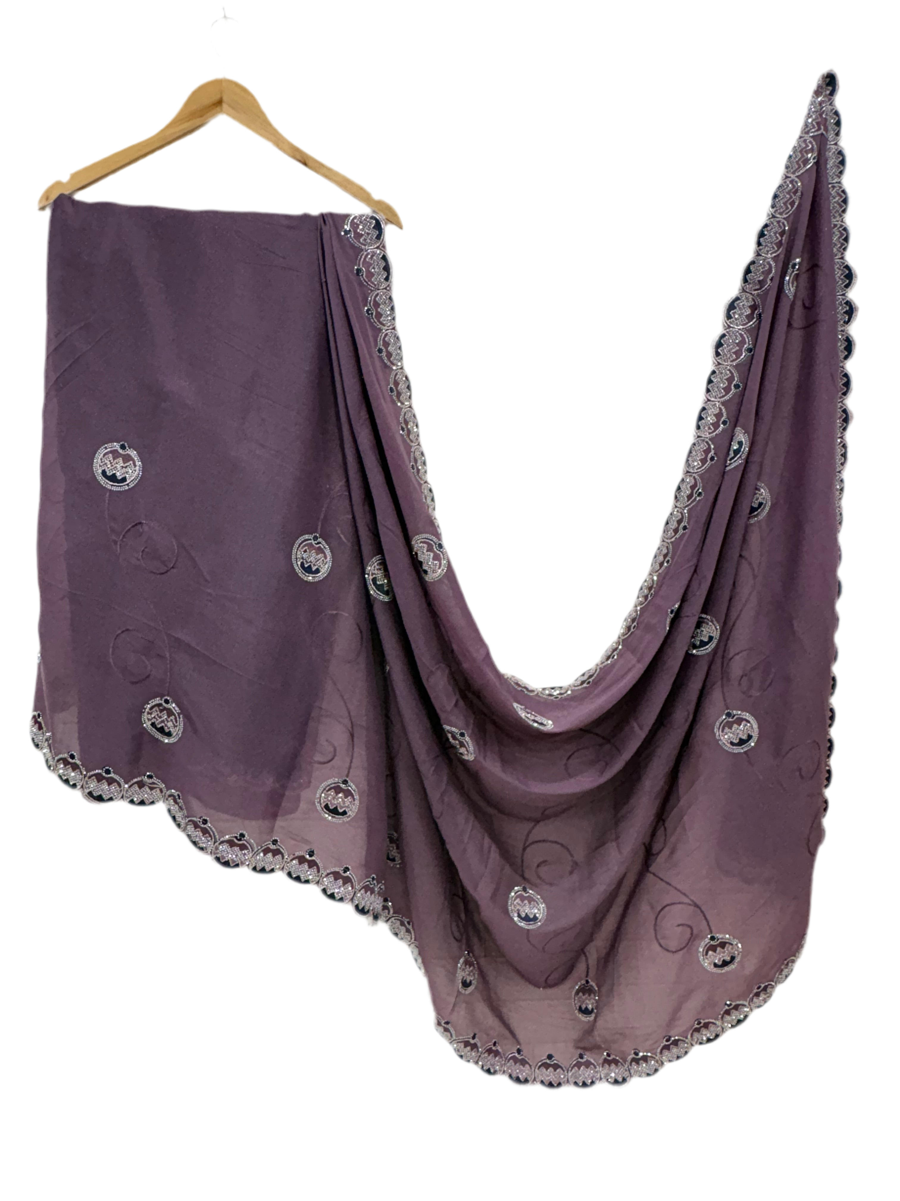 Saree Purple Embroidered Saree with purple mauve and georgette or organza Medallion Butti and Scalloped Border. It is a sheer saree with scattered embroidery and stonework.