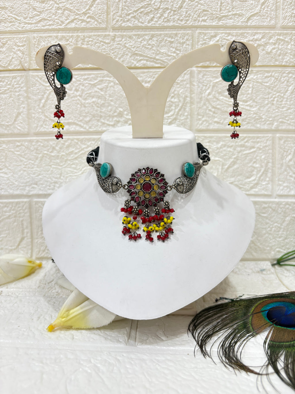Name: Meenakari Fish Motif Choker Set
Collection: Boho Tribal Jewellery
Colour: Oxidised Silver with Multicolour Beads (Red, Yellow, Green) and Turquoise Stone