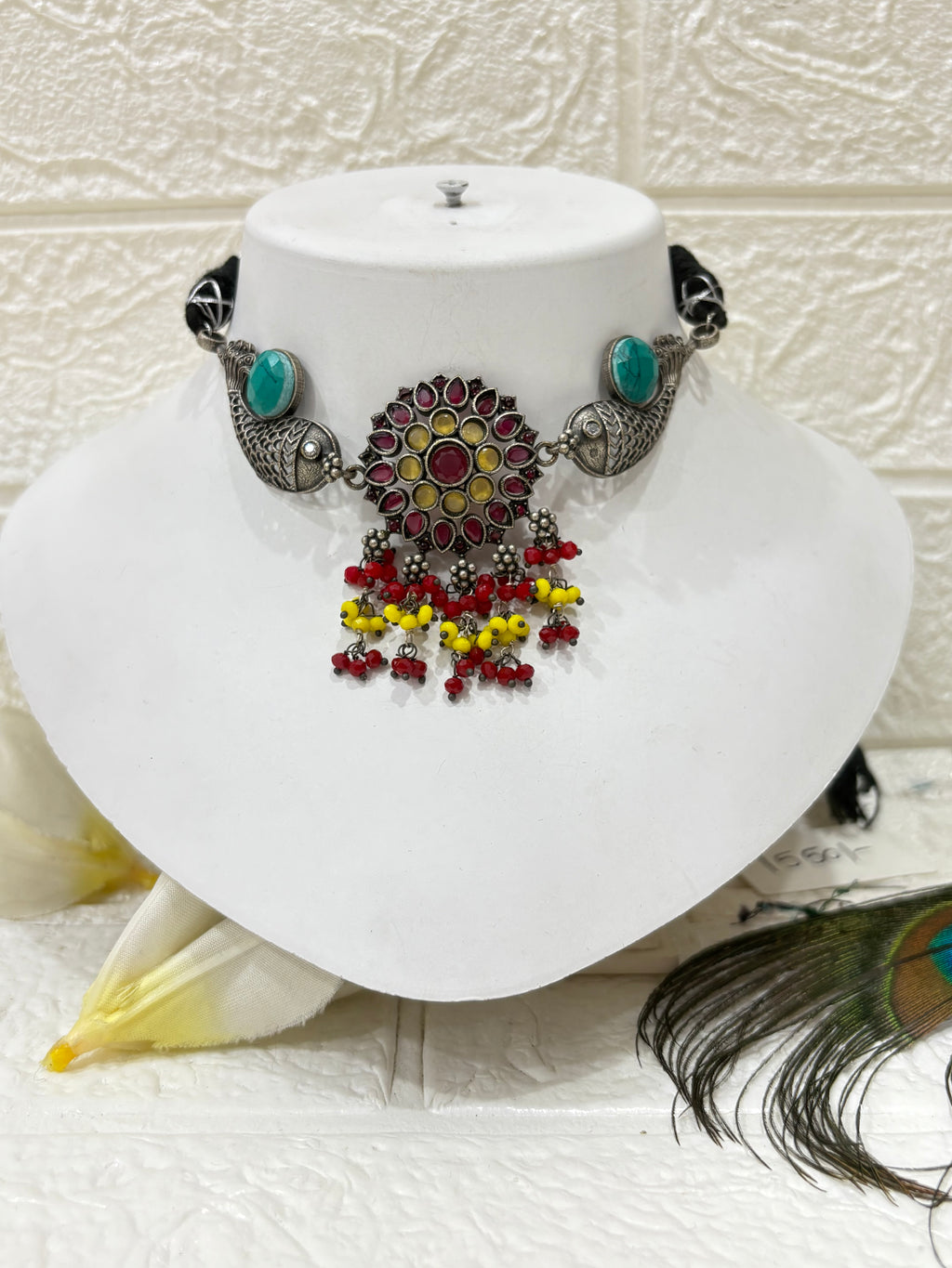 Name: Meenakari Fish Motif Choker Set
Collection: Boho Tribal Jewellery
Colour: Oxidised Silver with Multicolour Beads (Red, Yellow, Green) and Turquoise Stone