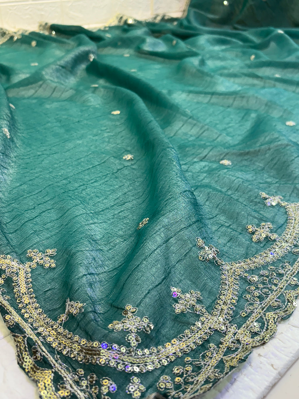 Name: Teal Green burberry silk Saree Elegant with delicate pearl and sequin floral embroidery along the border and scattered motifs across the drape.