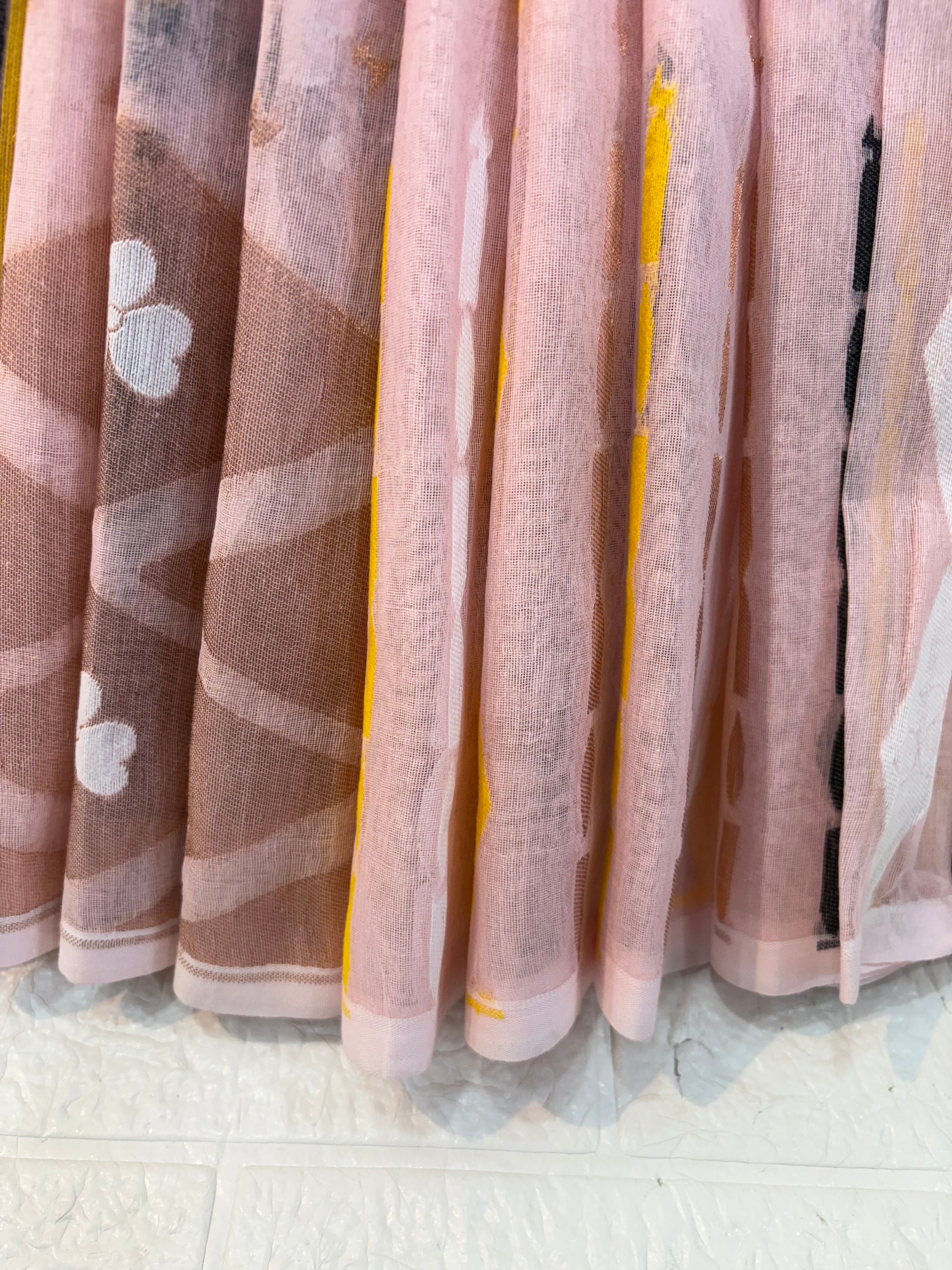 Pastel light pink Jamdani Saree cotton Jamdani, featuring geometric diamond motifs with delicate floral buttas and a soft, airy handwoven texture