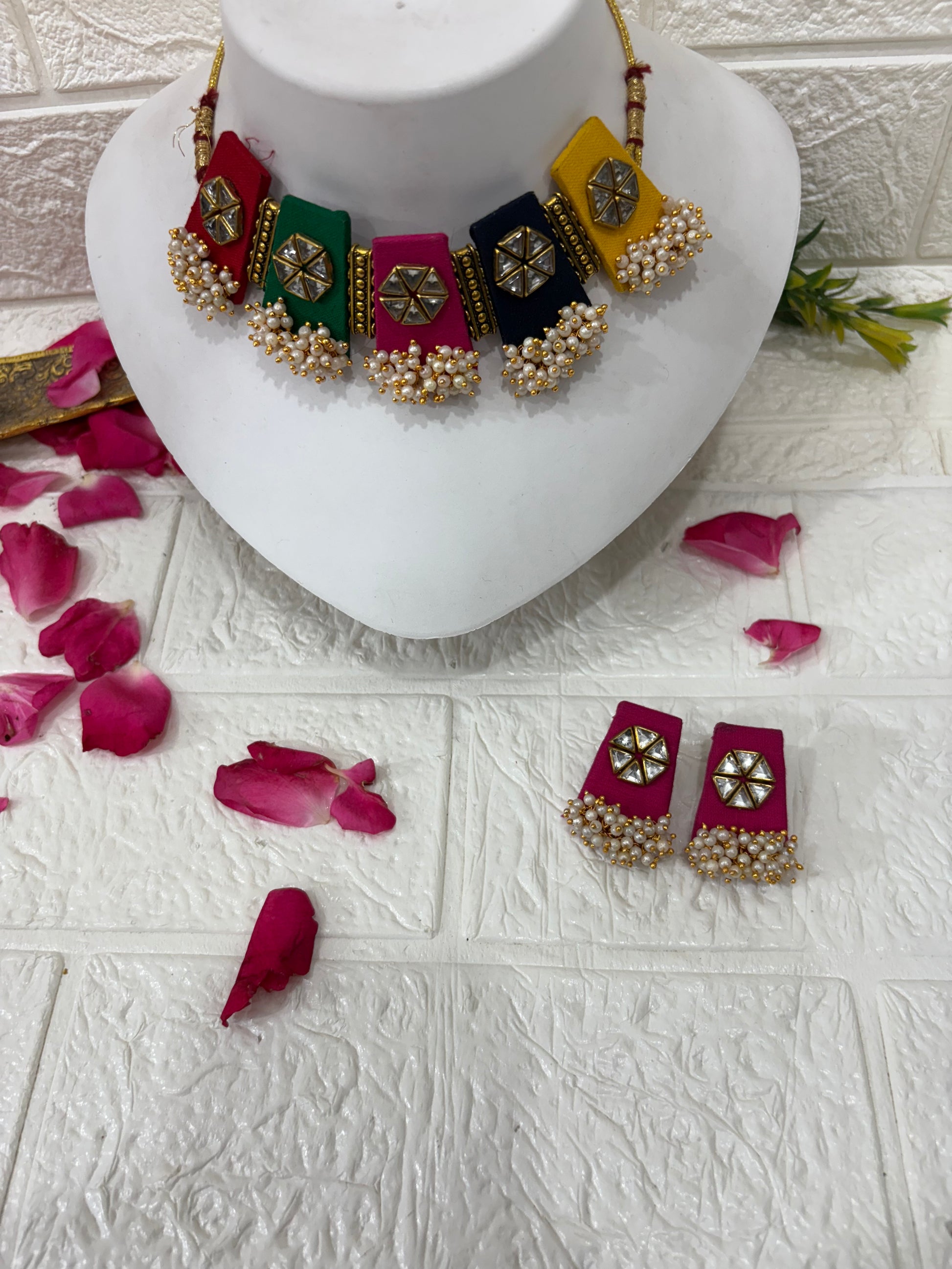 Multicolor Fabric Choker Set with Mirror Work & Pearl Drops

Collection:
Festive & Navratri Special Jewelry Collection

This name highlights the multicolor panels, mirror detailing, and pearl embellishments — making it perfect for traditional, festive, or