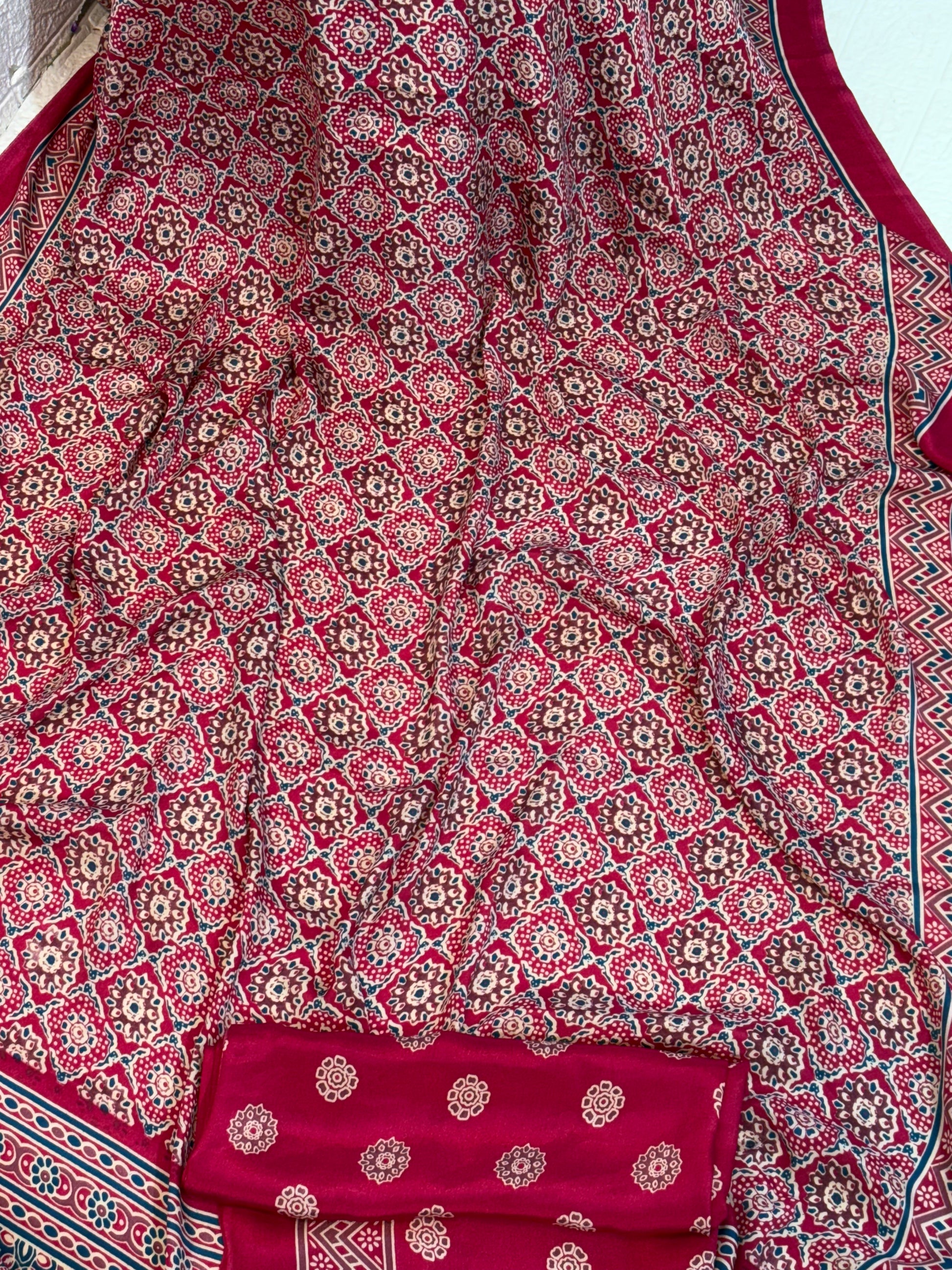 Maroon Ajrakh Motif Saree
Crafted in soft crepe fabric, this saree features traditional Ajrakh-inspired geometric prints with a classic border, offering comfort with timeless ethnic charm.