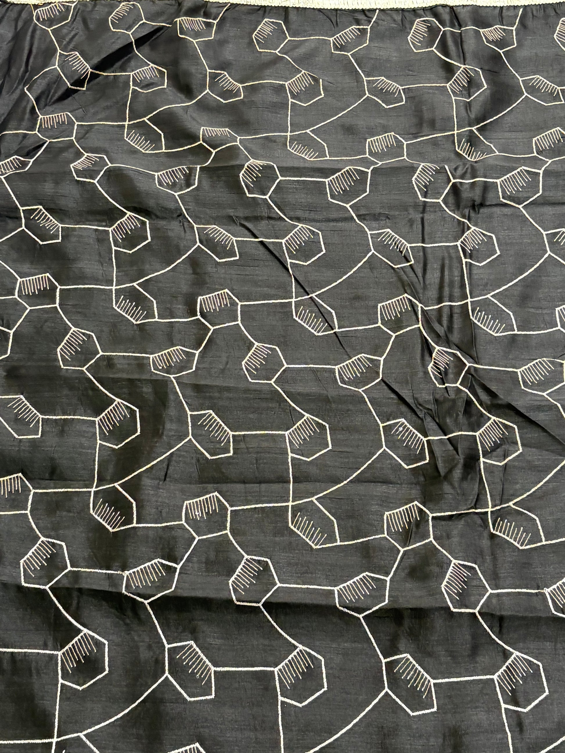 Black Saree This appears to be a silk Blend saree Cotton Silk or Art Silk with a modern Geometric Hexagonal Weave or Jaal design.