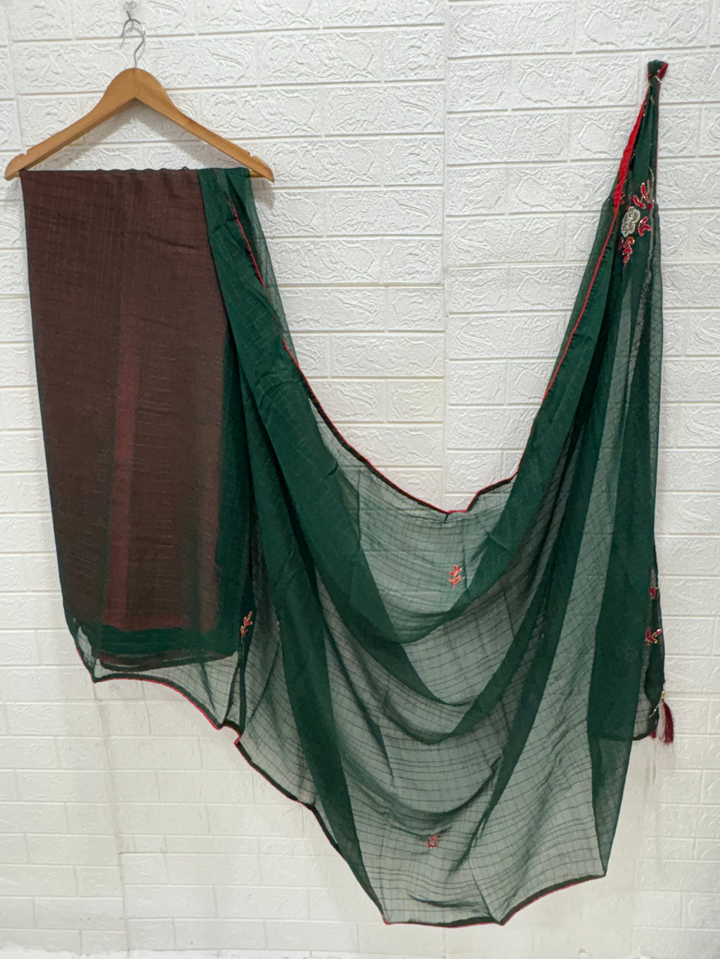 Lightweight green shimmer soft georgette self texture with embroider featuring delicate thread embroidery and red plain blouse perfect for festival